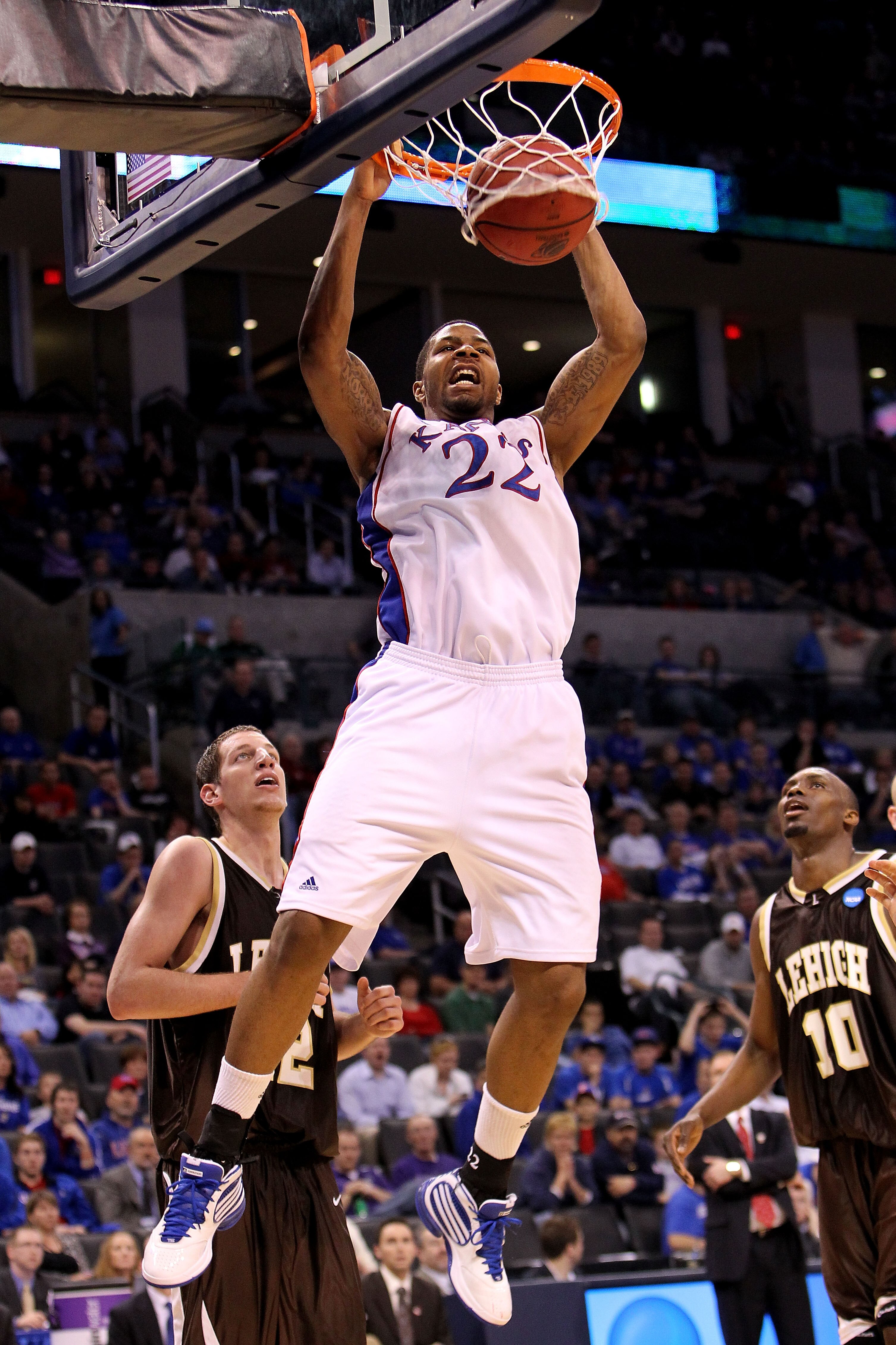 OKLAHOMA CITY - MARCH 18:  Marcus Morris #22 of the Kansas Jayhawks dunks against the Lehigh Mountain Hawks during the first round of the 2010 NCAA men's basketball tournament at Ford Center on March 18, 2010 in Oklahoma City, Oklahoma.  (Photo by Ronald