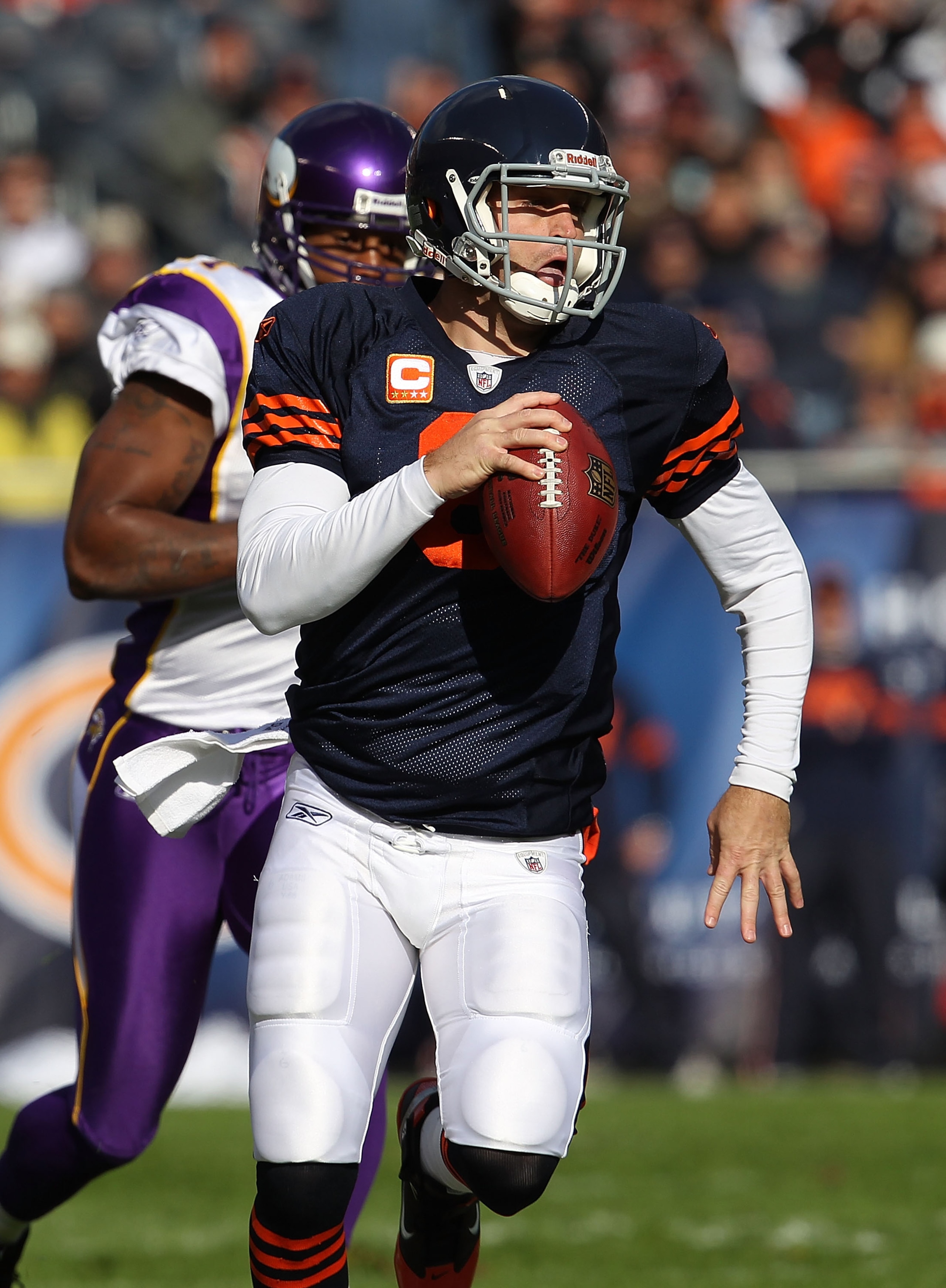 CHICAGO - NOVEMBER 14: Jay Cutler #6 of the Chicago Bears runs for a first down as Ray Edwards #91 of the Minnesota Vikings gives chase at Soldier Field on November 14, 2010 in Chicago, Illinois. The Bears defeated the Vikings 27-13. (Photo by Jonathan Da