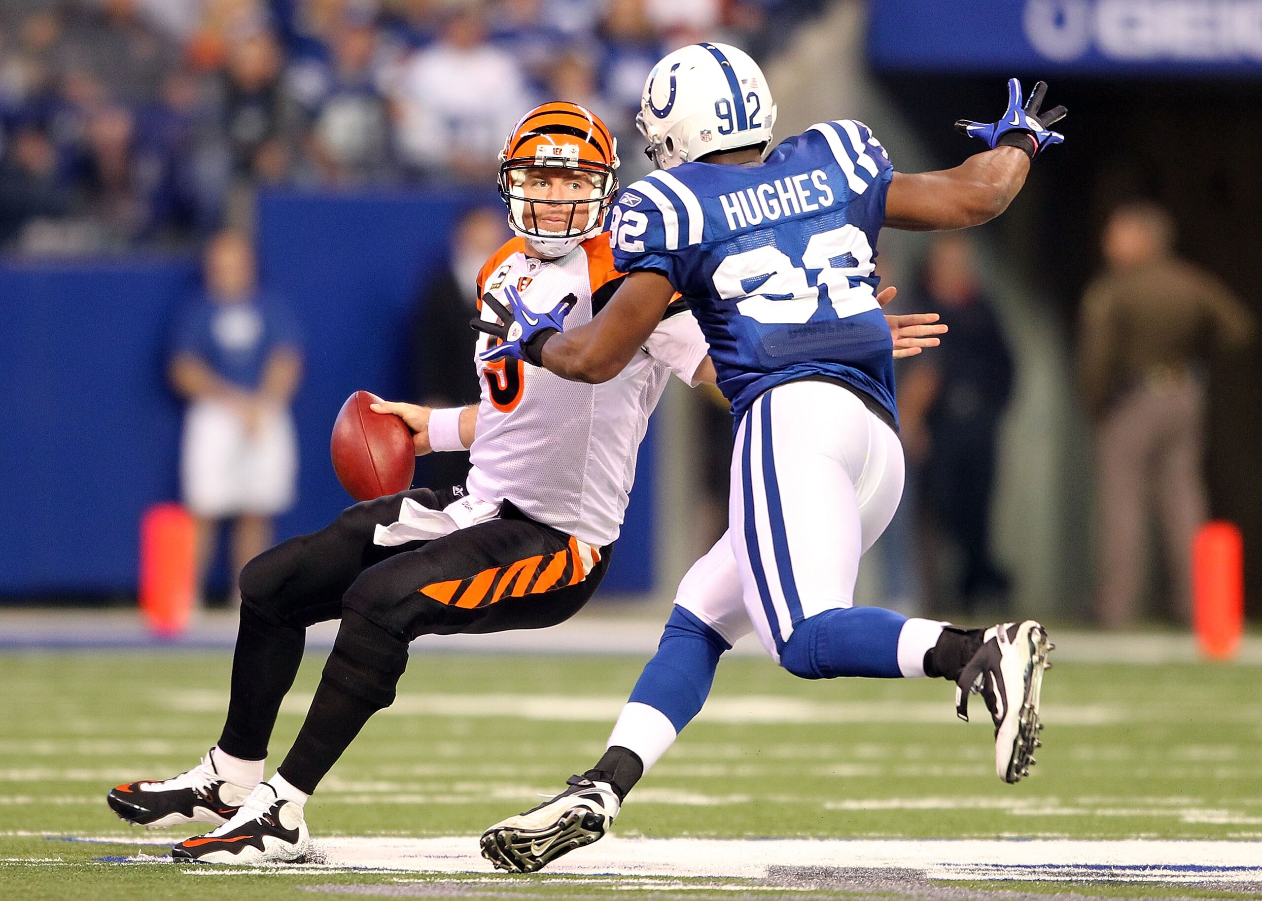 INDIANAPOLIS - NOVEMBER 14: Carson Palmer #9 of the Cincinnati Bengals tries to avoid Jerry Hughes #92 of the Indianapolis Colts during the NFL game at Lucas Oil Stadium on November 14, 2010 in Indianapolis, Indiana. The Colts won 23-17. (Photo by Andy INDIANAPOLIS - NOVEMBER 14: Carson Palmer #9 of the Cincinnati Bengals tries to avoid Jerry Hughes #92 of the Indianapolis Colts during the NFL game at Lucas Oil Stadium on November 14, 2010 in Indianapolis, Indiana. The Colts won 23-17. (Photo by Andy