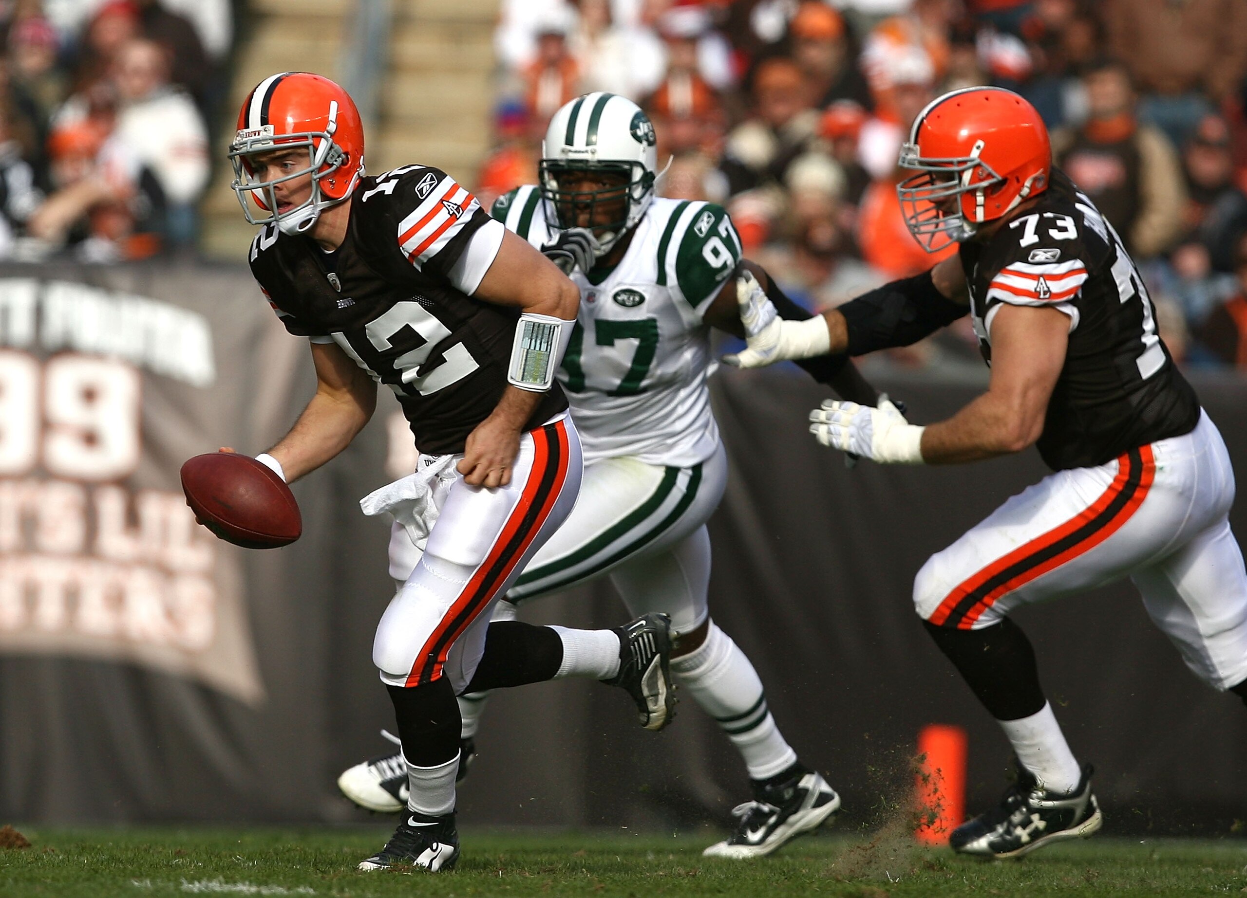 CLEVELAND - NOVEMBER 14:  Quarterback Colt McCoy #12 of the Cleveland Browns runs away from linebacker Calvin Pace #97 of the New York Jets at Cleveland Browns Stadium on November 14, 2010 in Cleveland, Ohio.  (Photo by Matt Sullivan/Getty Images)