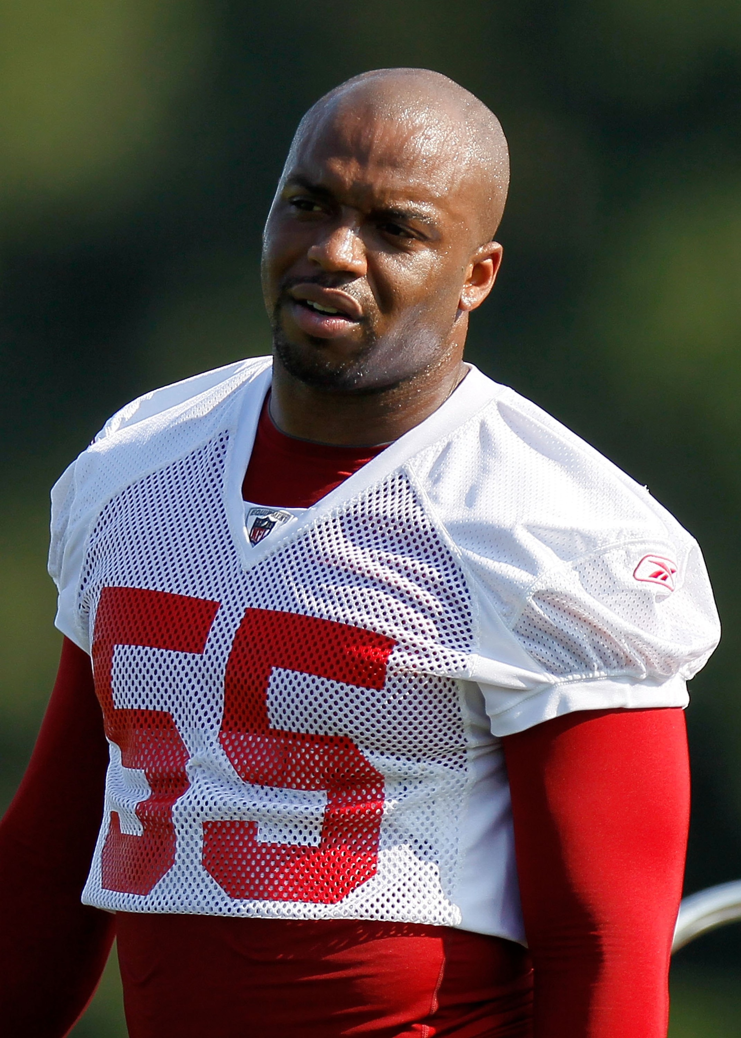 FLOWERY BRANCH, GA - JULY 30:  John Abraham #55 of the Atlanta Falcons runs drills during opening day of training camp on July 30, 2010 at the Falcons Training Complex in Flowery Branch, Georgia.  (Photo by Kevin C. Cox/Getty Images)