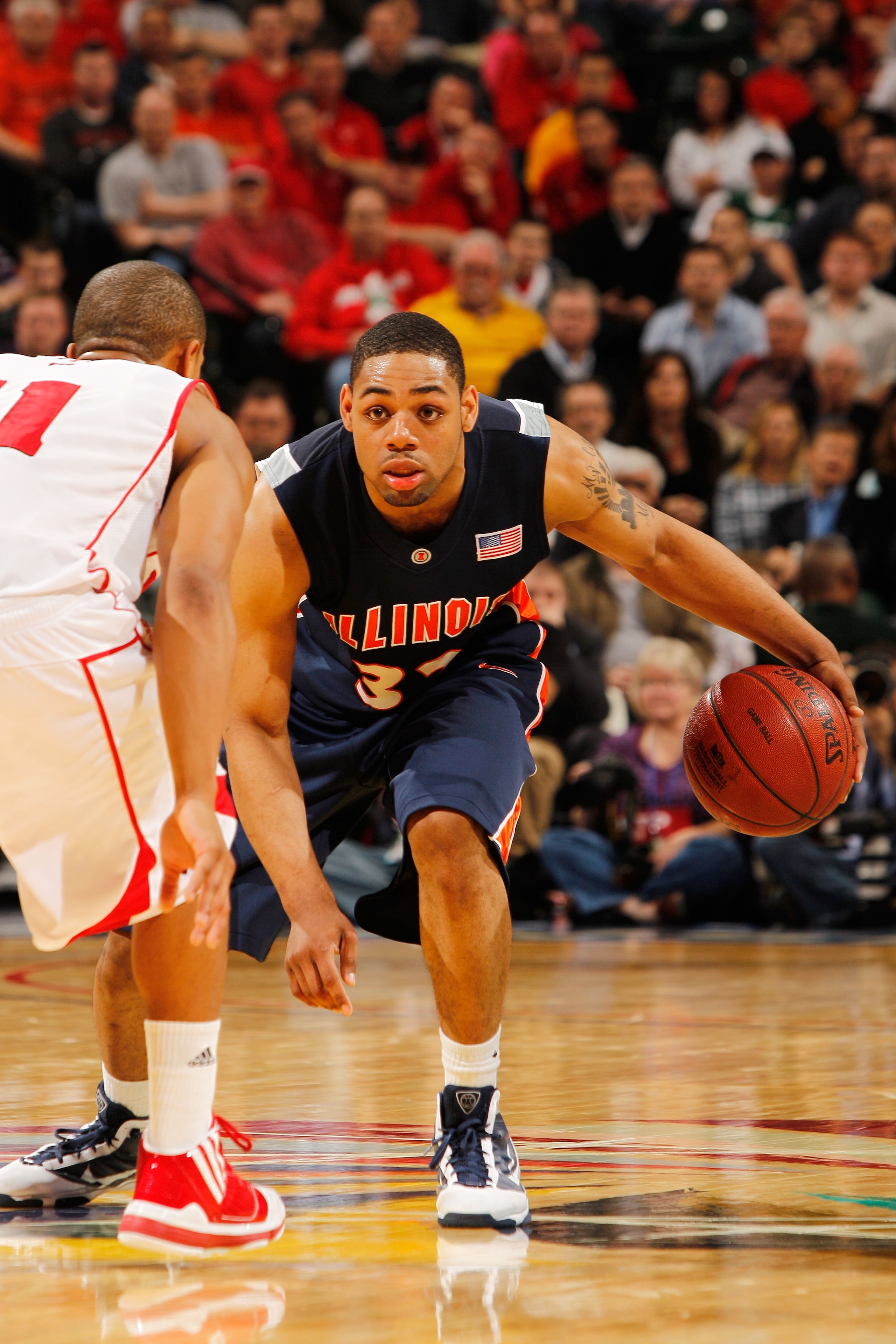 INDIANAPOLIS - MARCH 12:  Guard Demetri McCamey #32 of the Illinois Fighting Illini controls the ball against the Wisconsin Badgers during the quarterfinals of the Big Ten Men's Basketball Tournament at Conseco Fieldhouse on March 12, 2010 in Indianapolis