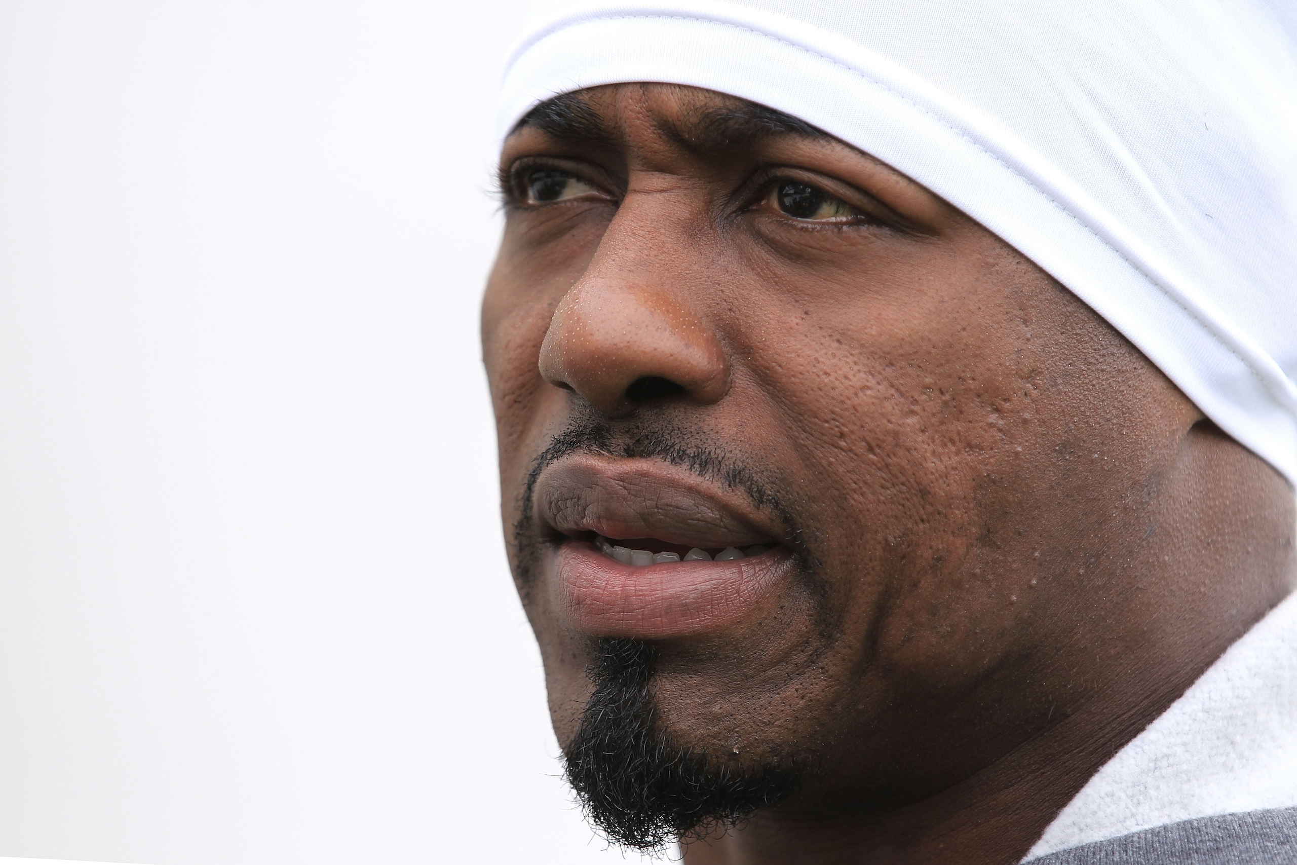 LONDON, ENGLAND - OCTOBER 29:  Brian Dawkins of the Denver Broncostalks to the media prior to the start of a team training session at The Brit Oval on October 29, 2010 in London, England. The Denver Broncos will play the San Francisco 49ers at Wembley Sta