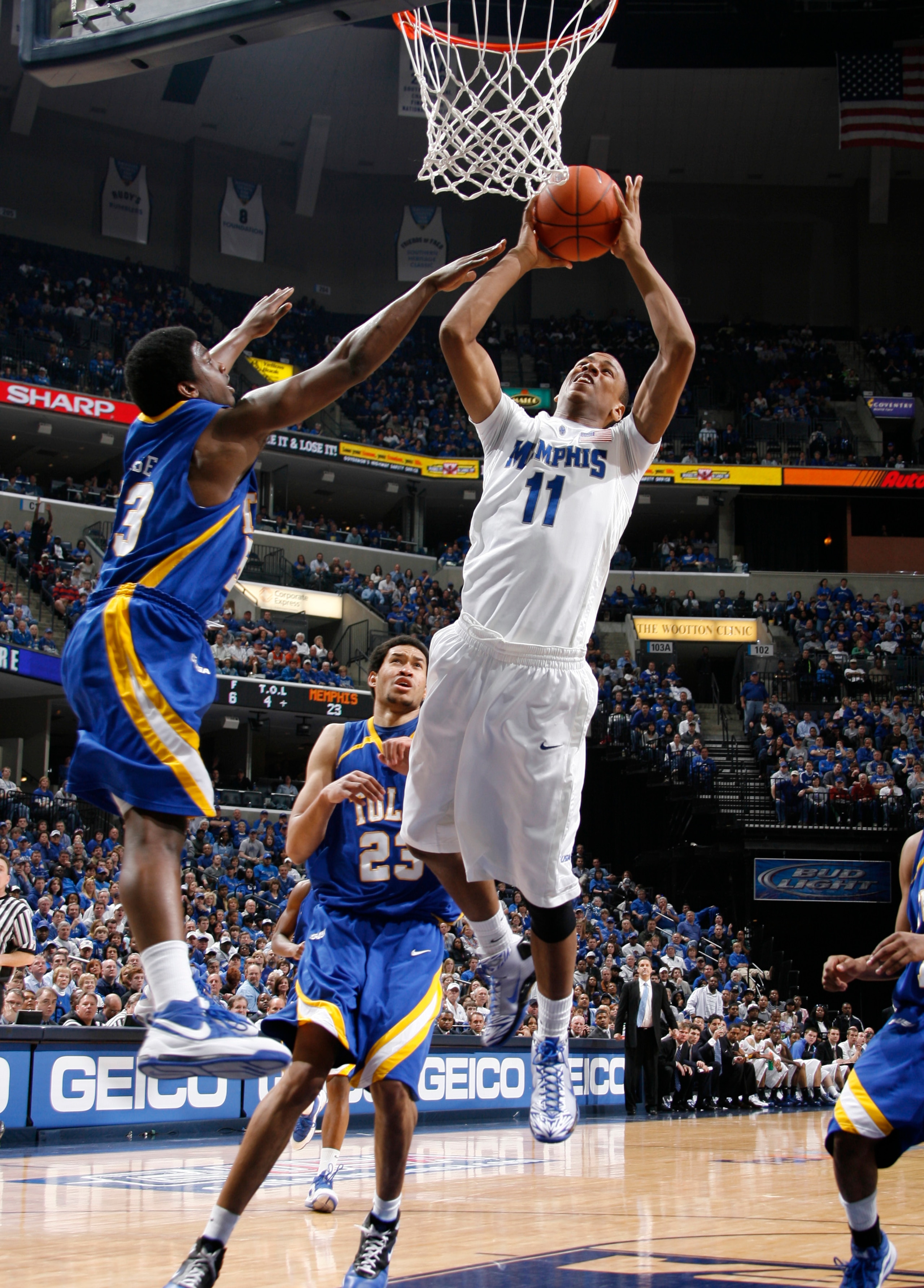 MEMPHIS, TN - MARCH 14:  Wesley Witherspoon #11 of the Memphis Tigers shoots over Ray Reese #53 of the Tulsa Golden Hurricane during the Championship of the Conference USA Basketball Tournament at FedExForum on March 14, 2009 in Memphis, Tennessee.  (Phot