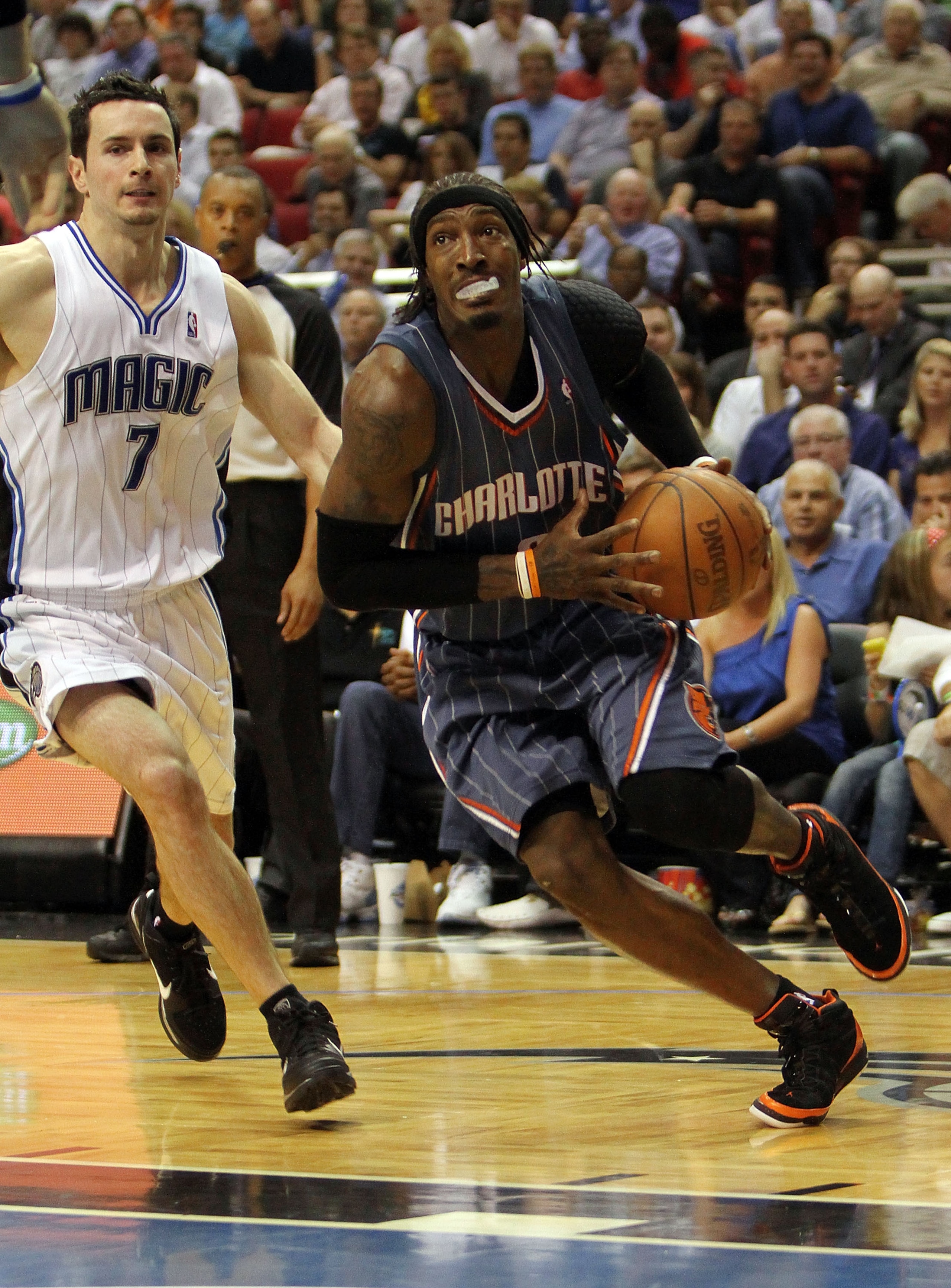 ORLANDO, FL - APRIL 21: Gerald Wallace #3 of the Charlotte Bobcats drives past J.J. Redick #7 of the Orlando Magic in Game Two of the Eastern Conference Quarterfinals during the 2010 NBA Playoffs at Amway Arena on April 21, 2010 in Orlando, Florida. The ORLANDO, FL - APRIL 21: Gerald Wallace #3 of the Charlotte Bobcats drives past J.J. Redick #7 of the Orlando Magic in Game Two of the Eastern Conference Quarterfinals during the 2010 NBA Playoffs at Amway Arena on April 21, 2010 in Orlando, Florida. The