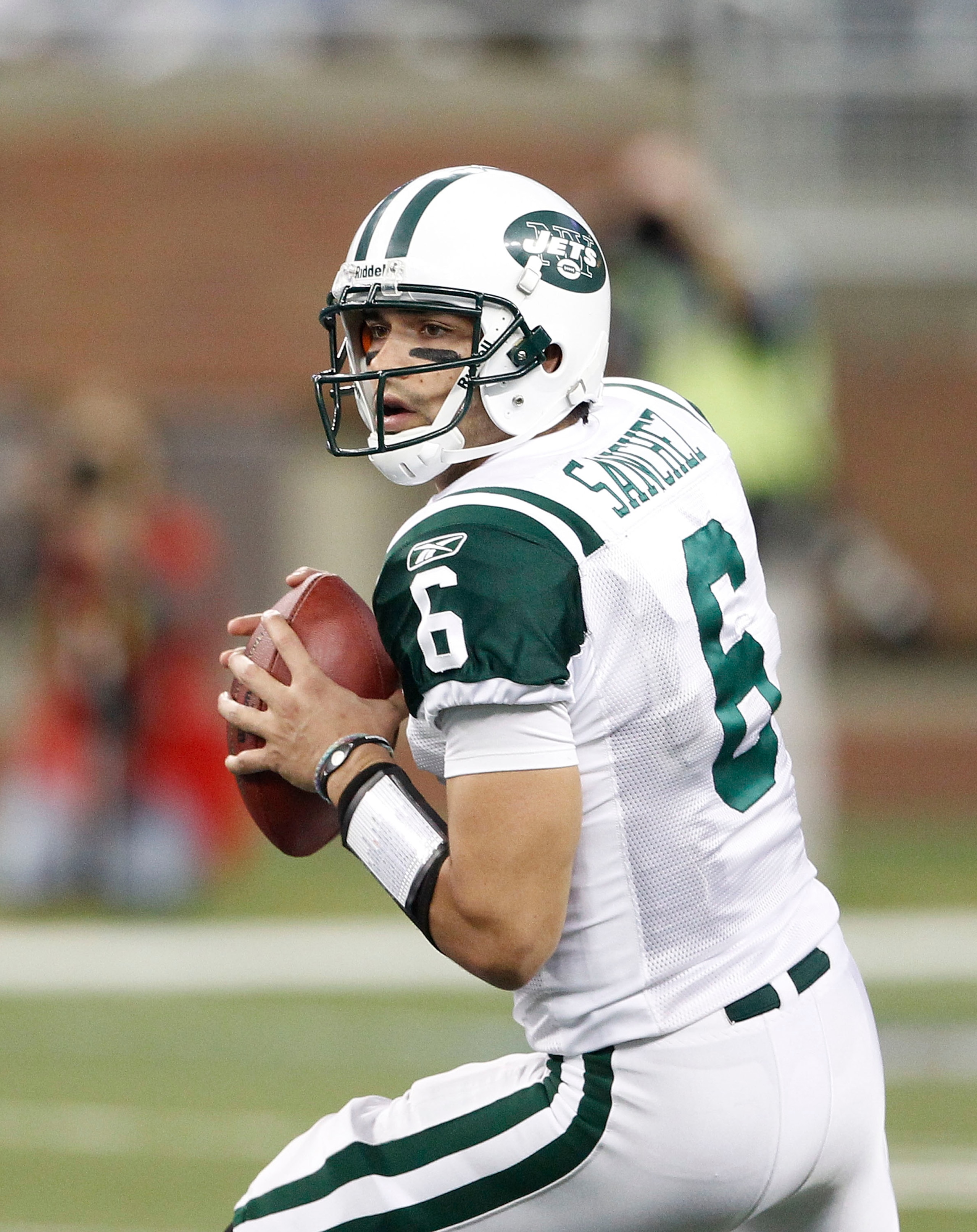 DETROIT - NOVEMBER 07:  Mark Sanchez #6 of the New York Jets looks to throw a pass during the game against the Detroit Lions at Ford Field on November 7, 2010 in Detroit, Michigan. The Jets defeated the Lions 23-20 in overtime.  (Photo by Leon Halip/Getty