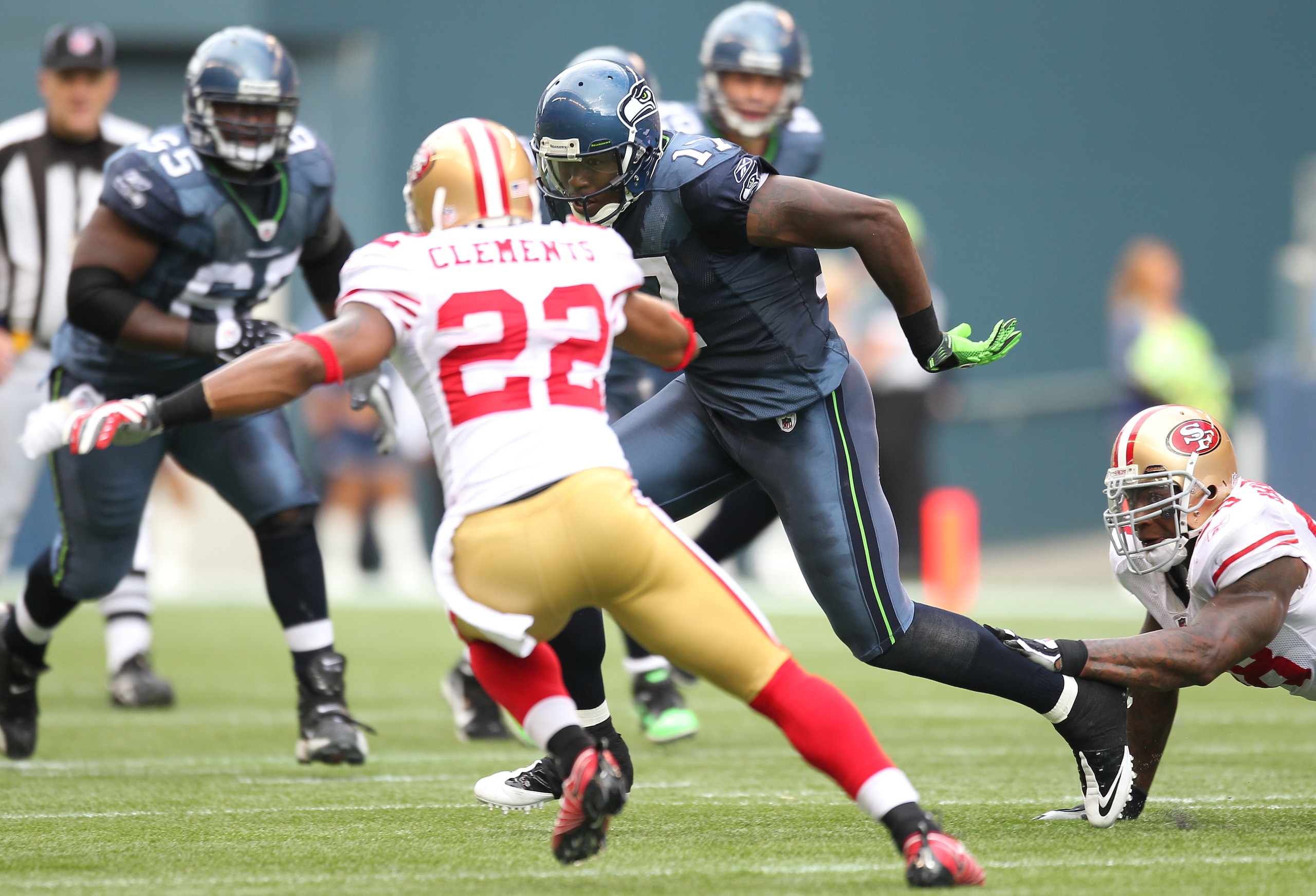 SEATTLE - SEPTEMBER 12:  Wide receiver Mike Williams #17 of the Seattle Seahawks rushes as Nate Clements #22 of the San Francisco 49ers moves in for the tackle during the NFL season opener at Qwest Field on September 12, 2010 in Seattle, Washington. (Phot