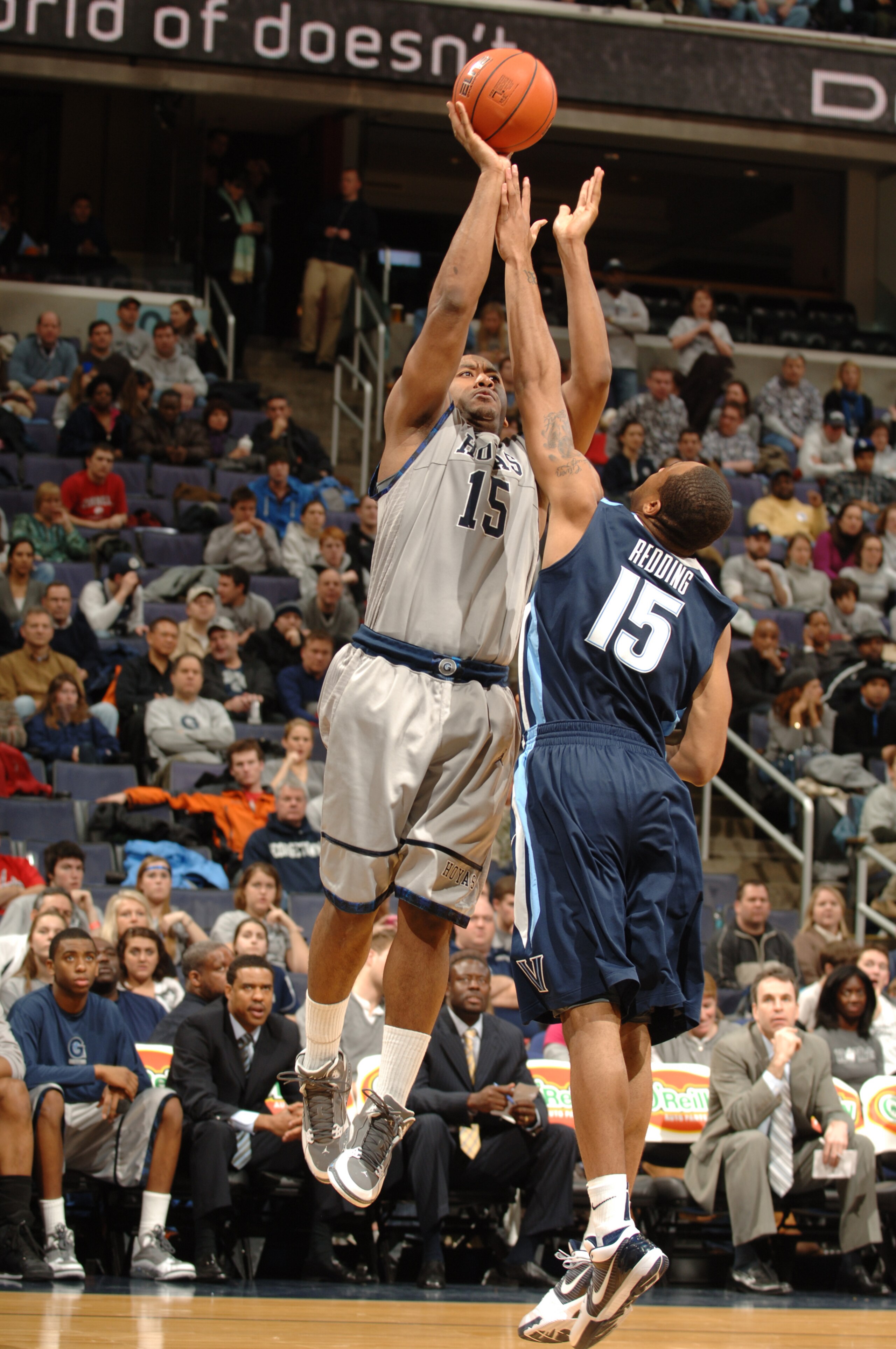 WASHINGTON - FEBRUARY 06:  Austin Freeman #15 of the Georgetown Hoyas takes a jump over Reggie Redding #15 of the Villanova Wildcats during a college basketball game on February 6, 2010 at the Verizon Center in Washington DC.  (Photo by Mitchell Layton/Ge