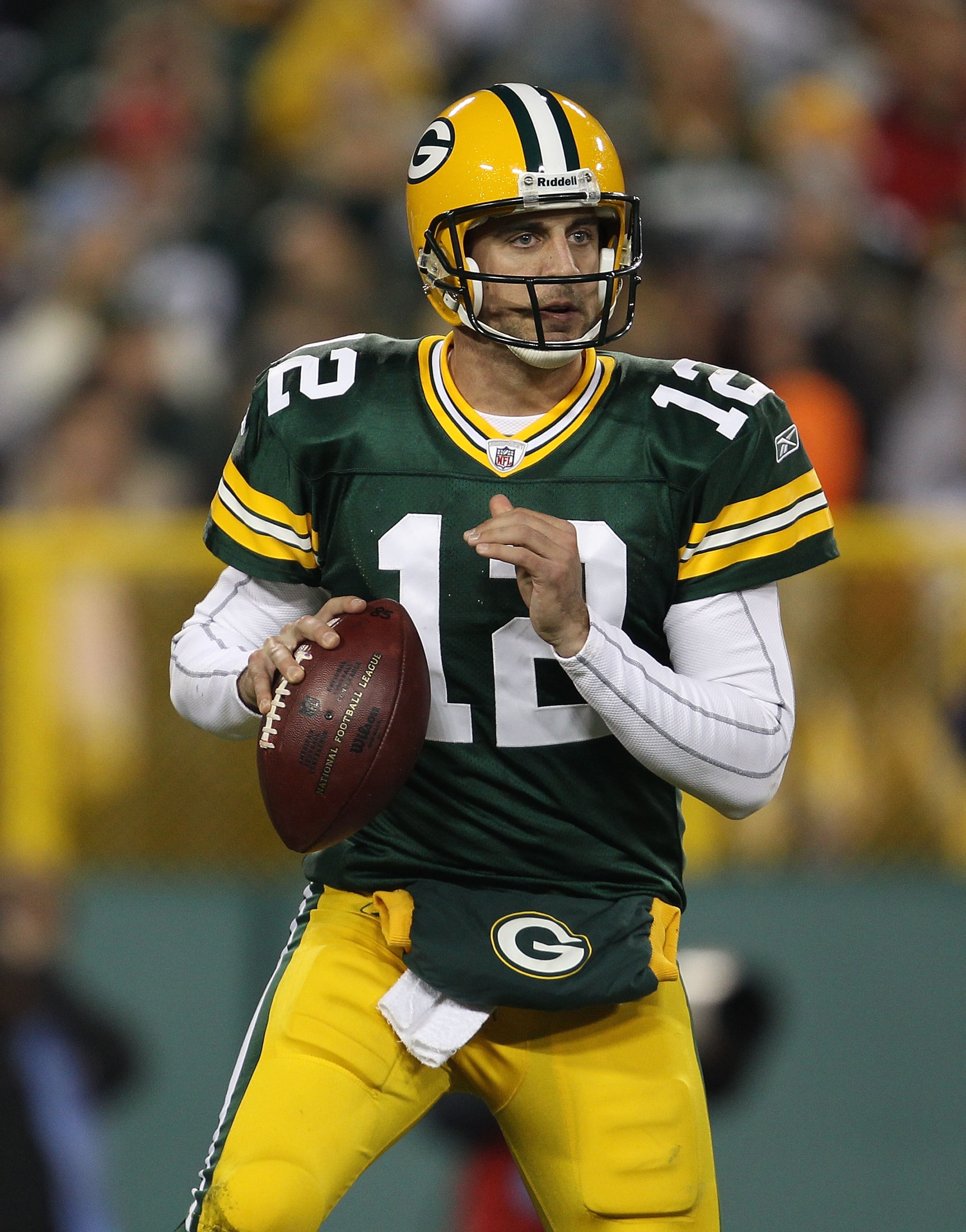 GREEN BAY, WI - NOVEMBER 07: Aaron Rodgers #12 of the Green Bay Packers looks for a receiver against the Dallas Cowboys at Lambeau Field on November 7, 2010 in Green Bay, Wisconsin. The Packers defeated the Cowboys 45-7. (Photo by Jonathan Daniel/Getty Im