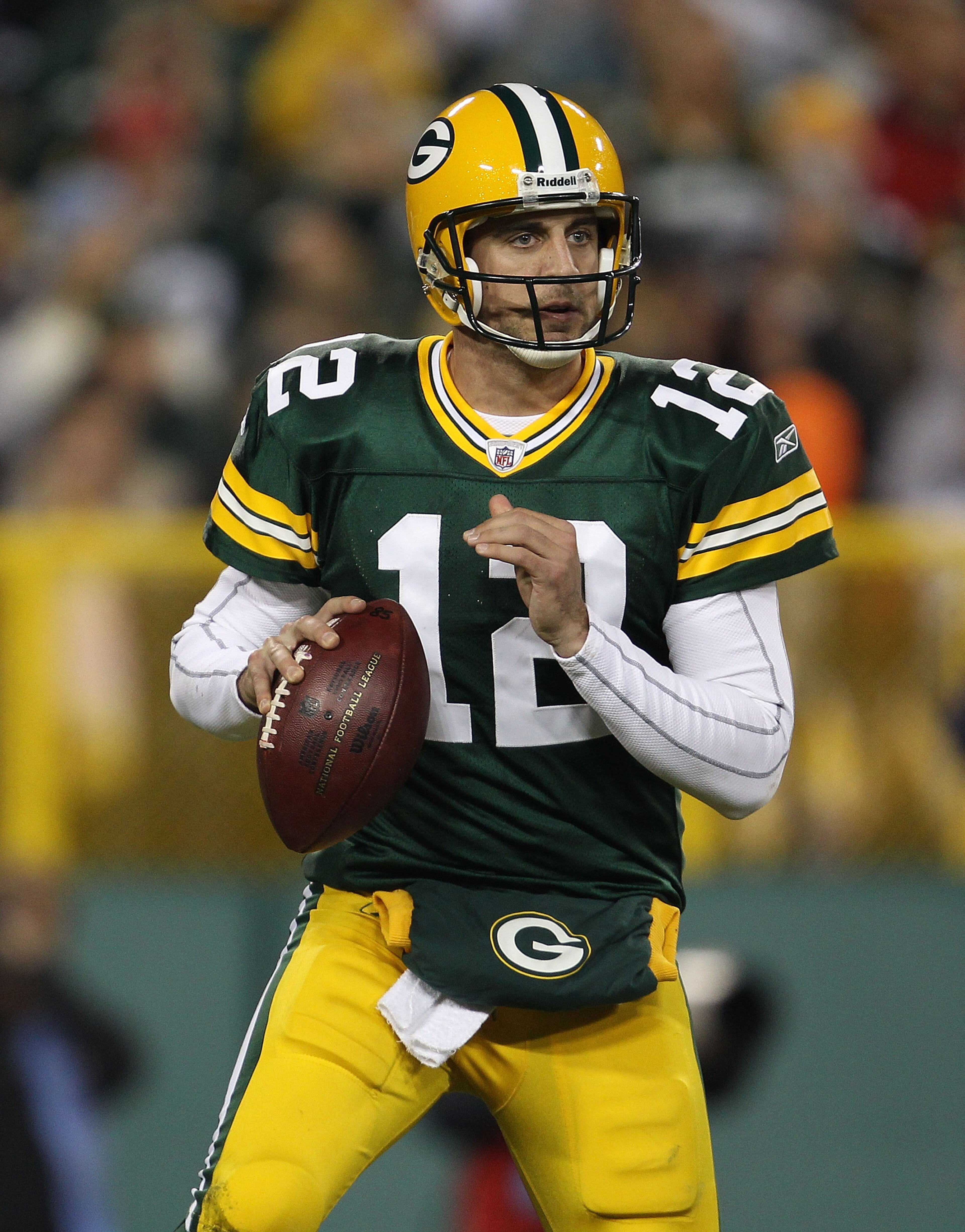GREEN BAY, WI - NOVEMBER 07: Aaron Rodgers #12 of the Green Bay Packers looks for a receiver against the Dallas Cowboys at Lambeau Field on November 7, 2010 in Green Bay, Wisconsin. The Packers defeated the Cowboys 45-7. (Photo by Jonathan Daniel/Getty Im