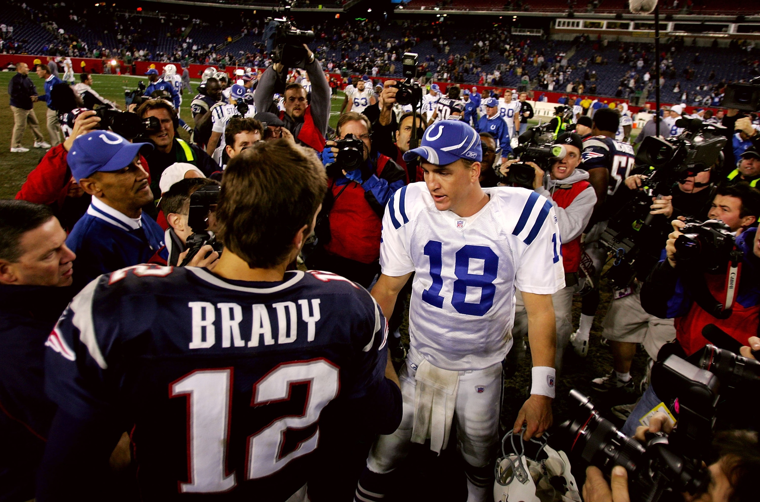 FOXBORO, MA - NOVEMBER 07:  Peyton Manning #18 of the Indianapolis Colts shakes hands with Tom Brady #12 of the New England Patriots after the Colts defeated the Patriots, 40-21 at Gillette Stadium on November 7, 2005 in Foxboro, Massachusetts.  (Photo by