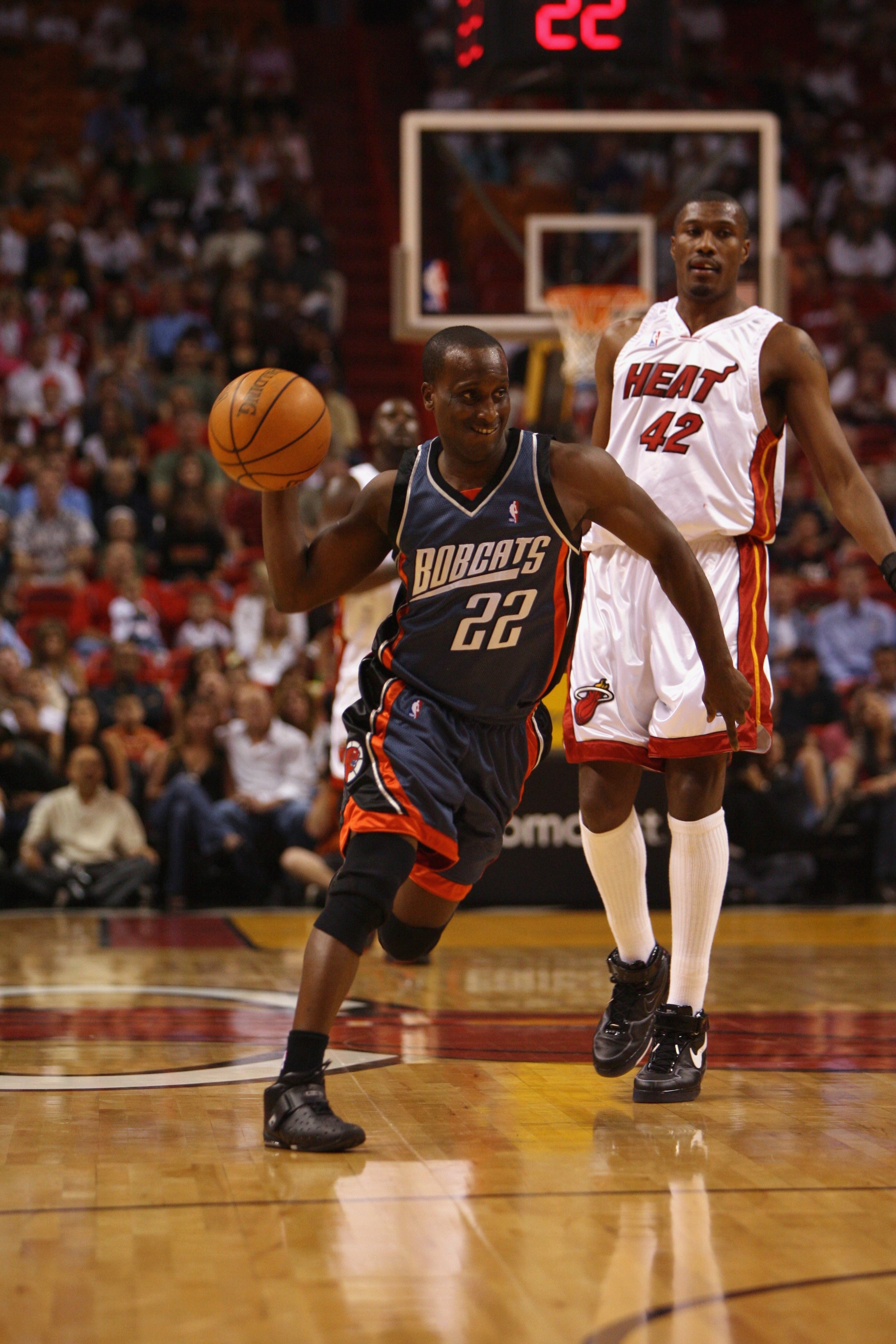 MIAMI - APRIL 8: Brevin Knight #22 of the Charlotte Bobcats drives the ball past James Posey #42 of the Miami Heat during the game at American Airlines Arena on April 8, 2007 in Miami, Florida. The Bobcats won 111-103. NOTE TO USER: User expressly ack MIAMI - APRIL 8: Brevin Knight #22 of the Charlotte Bobcats drives the ball past James Posey #42 of the Miami Heat during the game at American Airlines Arena on April 8, 2007 in Miami, Florida. The Bobcats won 111-103. NOTE TO USER: User expressly ack