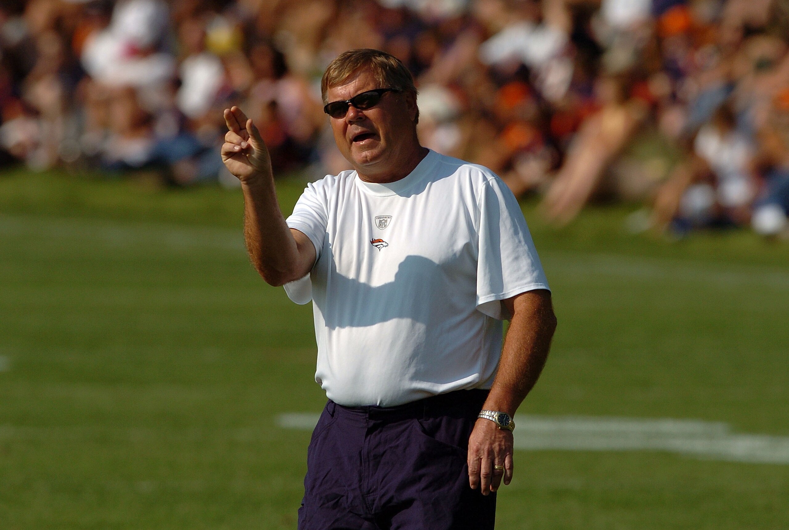 ENGLEWOOD, CO - JULY 31:  Assistant Head Coach/Quarterbacks Mike Heimerdinger  yells out instructions during workouts at training camp on July 31, 2007 at the Paul D. Bowlen Memorial Broncos Centre in Englewood, Colorado.   (Photo by Steve Dykes/Getty Ima