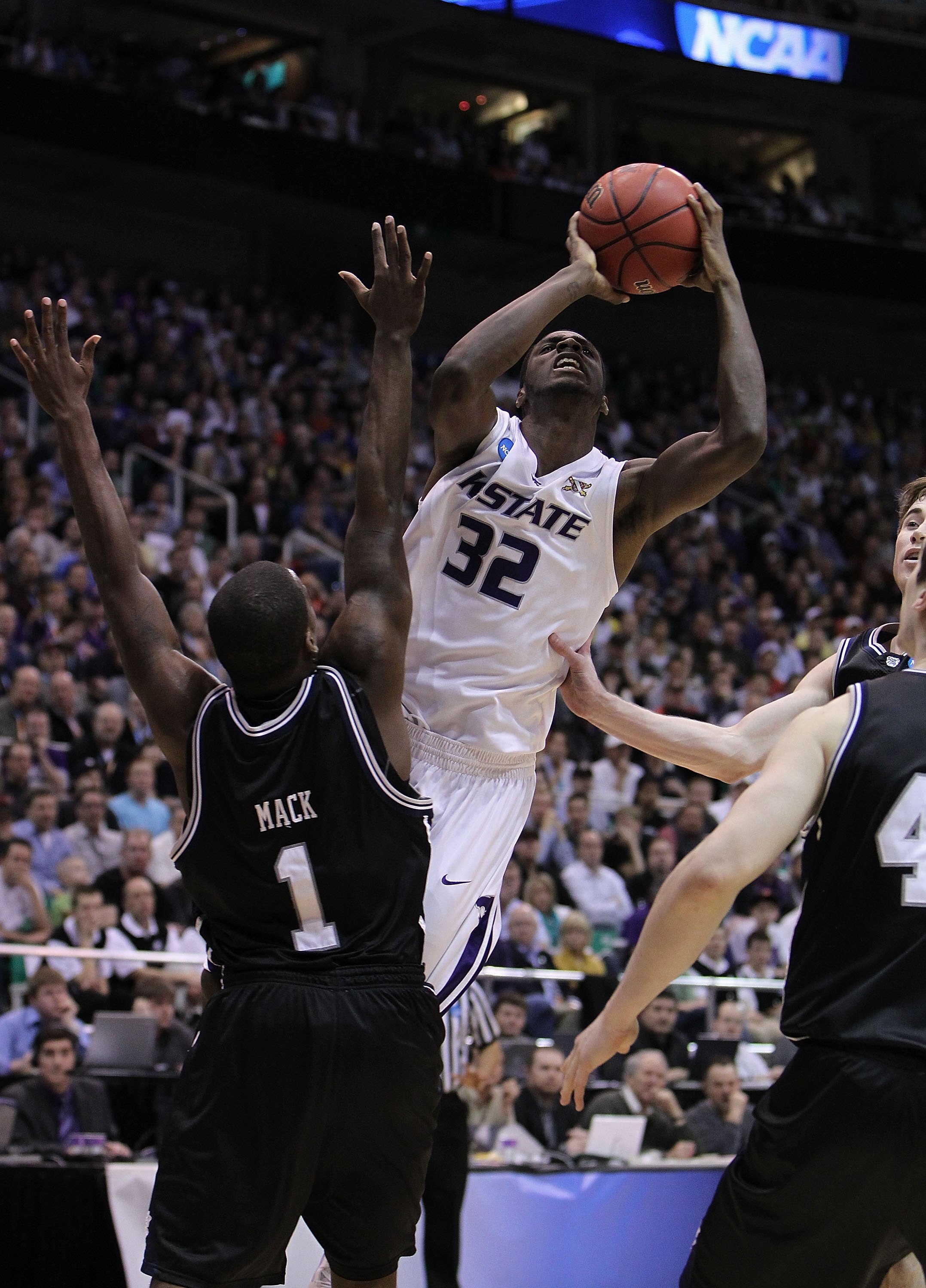 SALT LAKE CITY - MARCH 27: Jamar Samuels #32 of the Kansas State Wildcats shoots against Shelvin Mack #1 of the Butler Bulldogs during the west regional final of the 2010 NCAA men's basketball tournament at the Energy Solutions Arena on March 27, 2010 in SALT LAKE CITY - MARCH 27: Jamar Samuels #32 of the Kansas State Wildcats shoots against Shelvin Mack #1 of the Butler Bulldogs during the west regional final of the 2010 NCAA men's basketball tournament at the Energy Solutions Arena on March 27, 2010 in