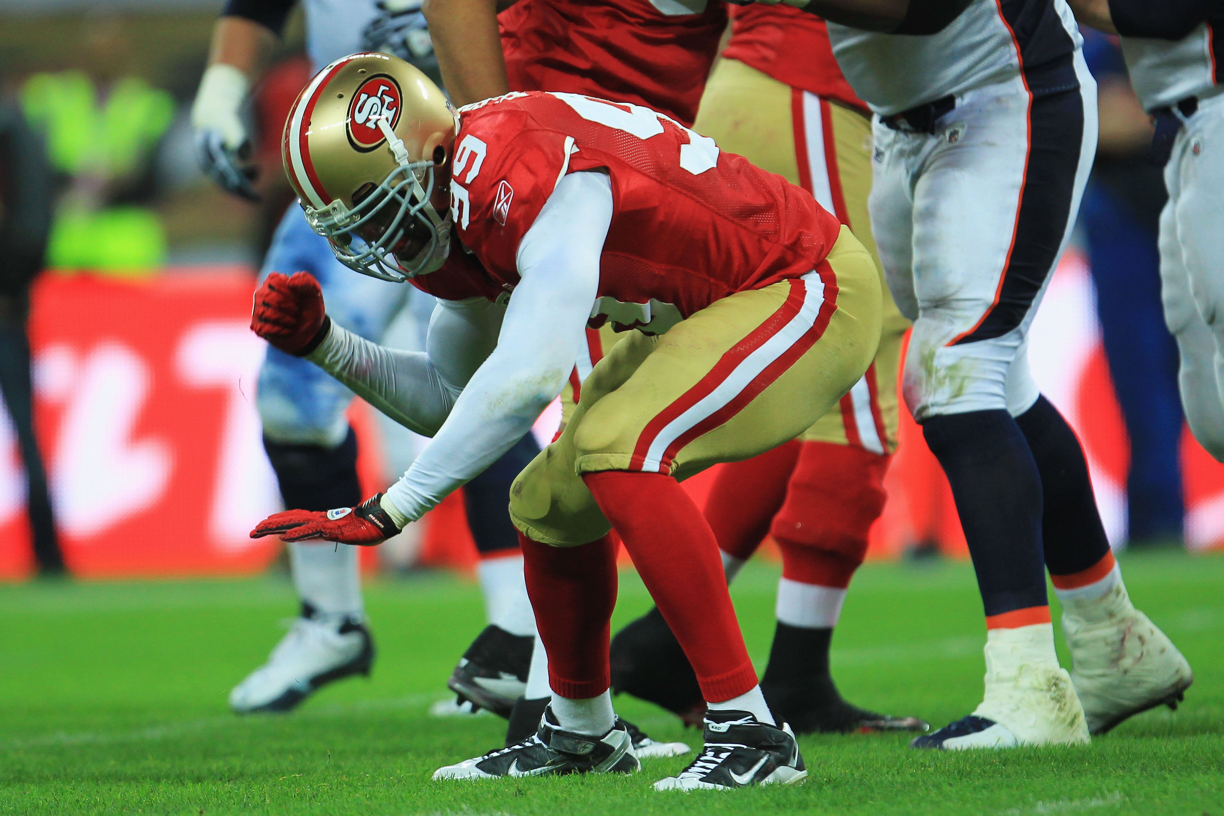 LONDON, ENGLAND - OCTOBER 31:  Manny Lawson #99 of San Francisco 49ers celebrates as he sacks Kyle Orton #8 of Denver Broncos during the NFL International Series match between Denver Broncos and San Francisco 49ers at Wembley Stadium on October 31, 2010 i