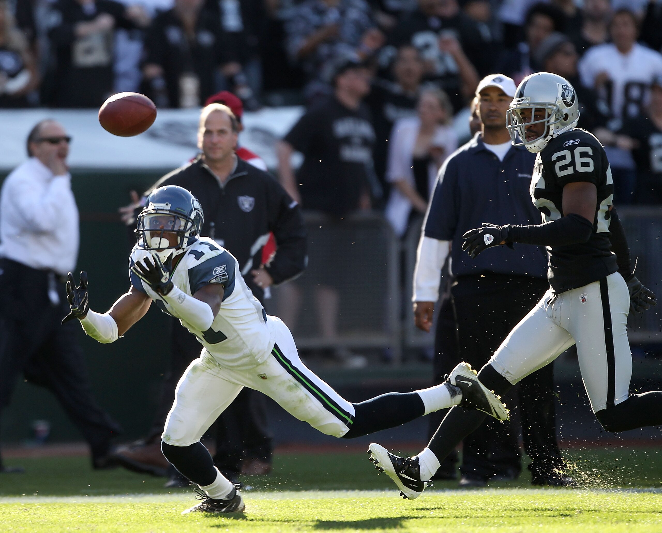 OAKLAND, CA - OCTOBER 31: Deon Butler #11 of the Seattle Seahawks in action against Stanford Routt #26 of the Oakland Raiders at Oakland-Alameda County Coliseum on October 31, 2010 in Oakland, California.  (Photo by Ezra Shaw/Getty Images)