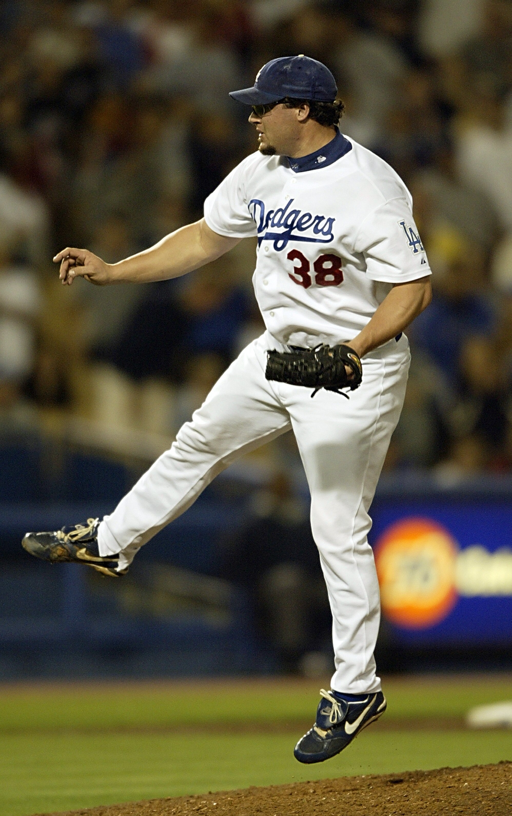 LOS ANGELES - AUGUST 22:  Closing pitcher Eric Gagne #38 of the Los Angeles Dodgers delivers a pitch in the ninth inning against the New York Mets during the National League game at Dodgers Stadium on August 22, 2003 in Los Angeles, California. Gagne reco