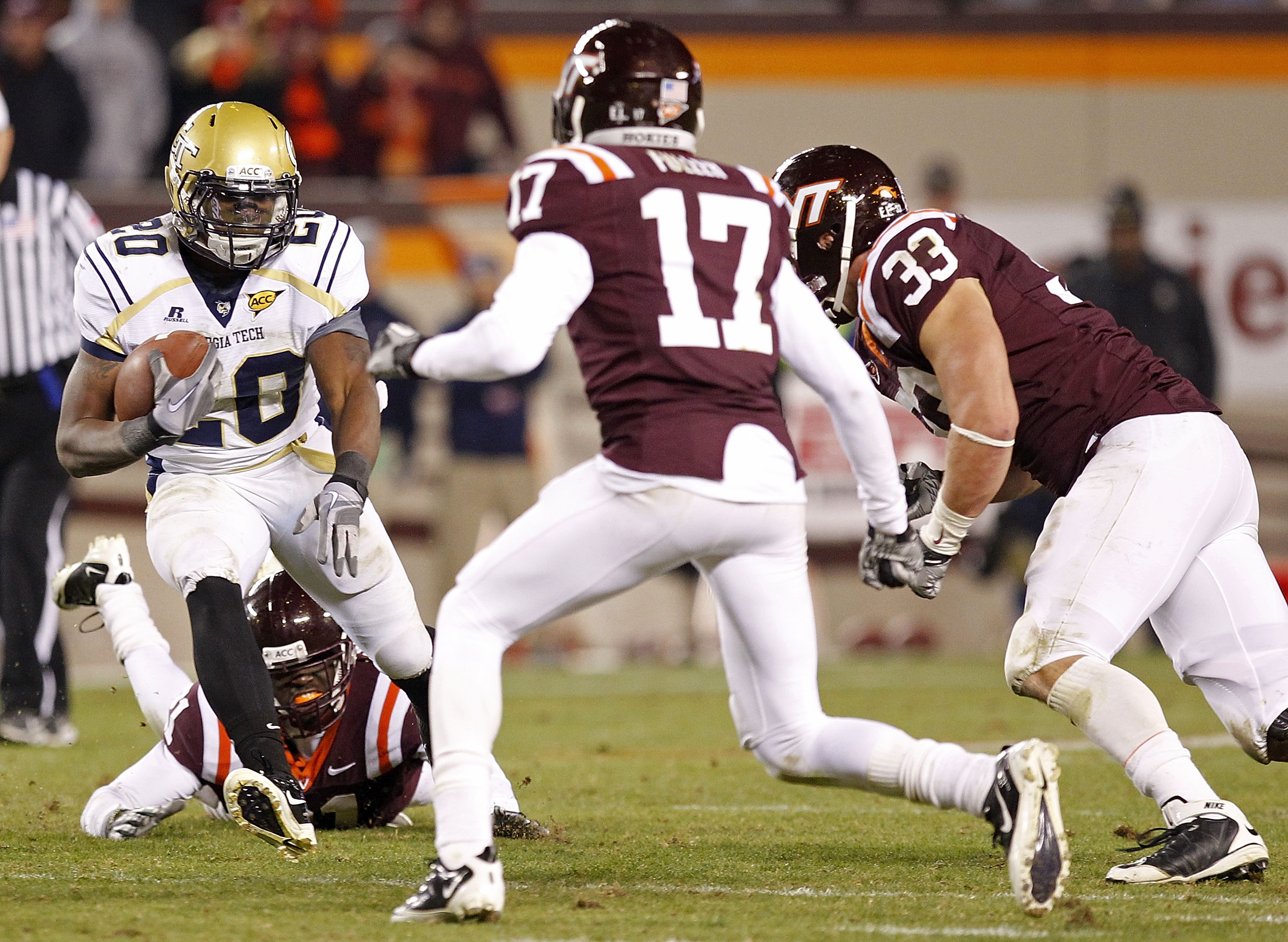 BLACKSBURG, VA - NOVEMBER 04: Running back Roddy Jones #20 of the Georgia Tech Yellow Jackets runs with the ball as defensive end Chris Drager #33 of the Virginia Tech Hokies and cornerback Kyle Fuller #17 of the Virginia Tech Hokies chase at Lane Stadium