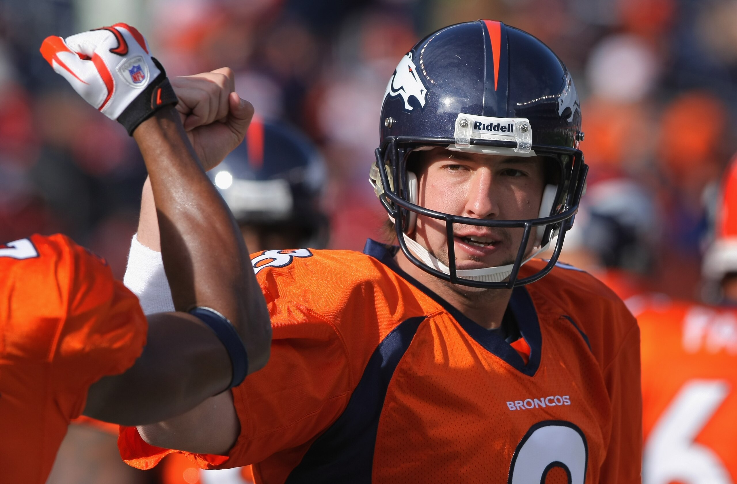 DENVER - NOVEMBER 14: Quarterback Kyle Orton #8 of the Denver Broncos greets his teammates as they enter the field to face the Kansas City Chiefs at INVESCO Field at Mile High on November 14, 2010 in Denver, Colorado. The Broncos defeated the Chiefs 49-2 DENVER - NOVEMBER 14: Quarterback Kyle Orton #8 of the Denver Broncos greets his teammates as they enter the field to face the Kansas City Chiefs at INVESCO Field at Mile High on November 14, 2010 in Denver, Colorado. The Broncos defeated the Chiefs 49-2
