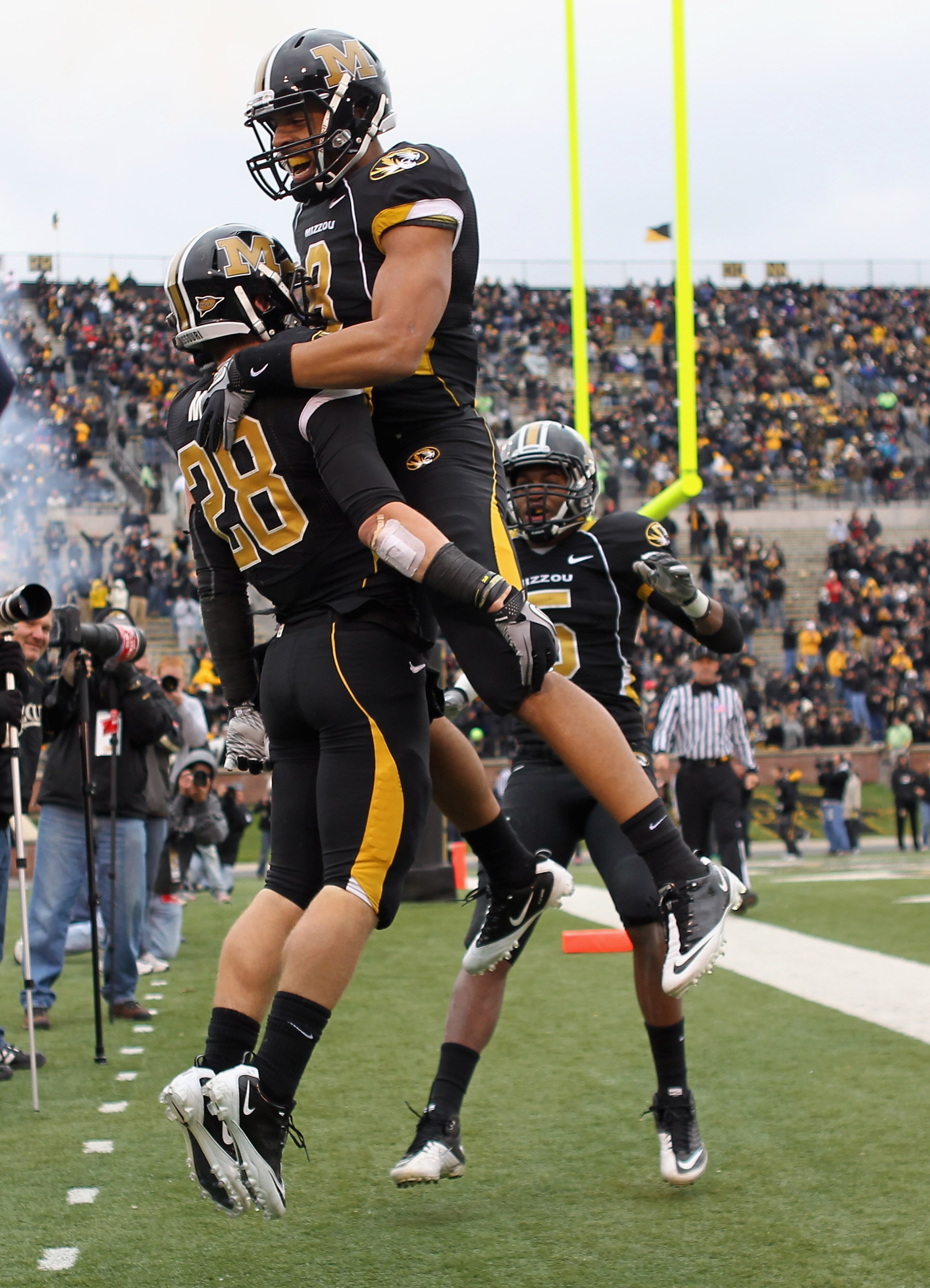 COLUMBIA, MO - NOVEMBER 13:  Wes Kemp #8  of the Missouri Tigers congratulates T.J.Moe #28 in the end zone after Moe scored a touchdown during the game against the Kansas State Wildcats on November 13, 2010 at Faurot Field/Memorial Stadium in Columbia, Mi