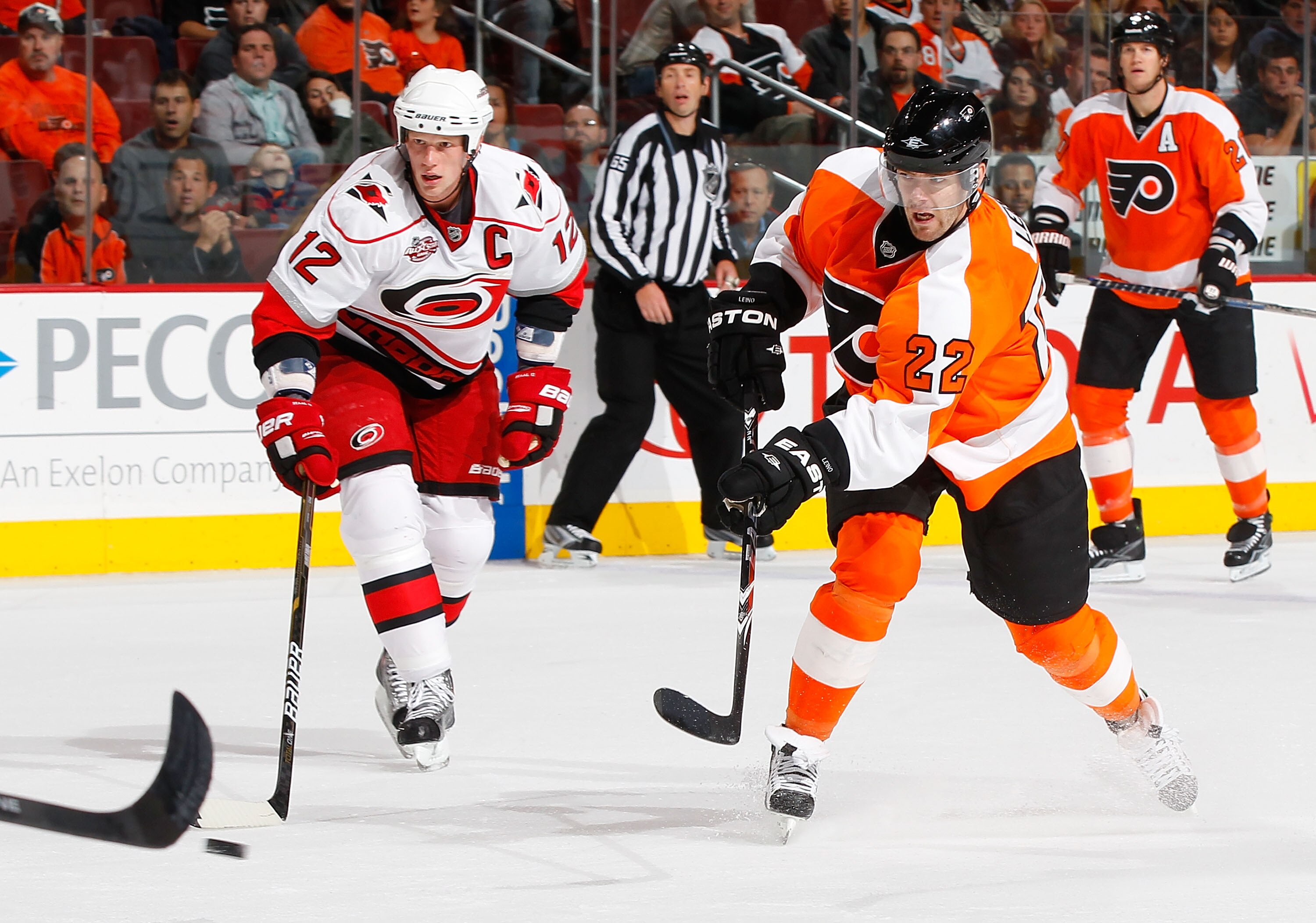PHILADELPHIA - NOVEMBER 01:  Ville Leino #22 of the Philadelphia Flyers skates against Eric Staal #12 of the Carolina Hurricanes on November 1, 2010 at the Wells Fargo Center in Philadelphia, Pennsylvania. Flyers defeat the Hurricanes 3-2.  (Photo by Mike
