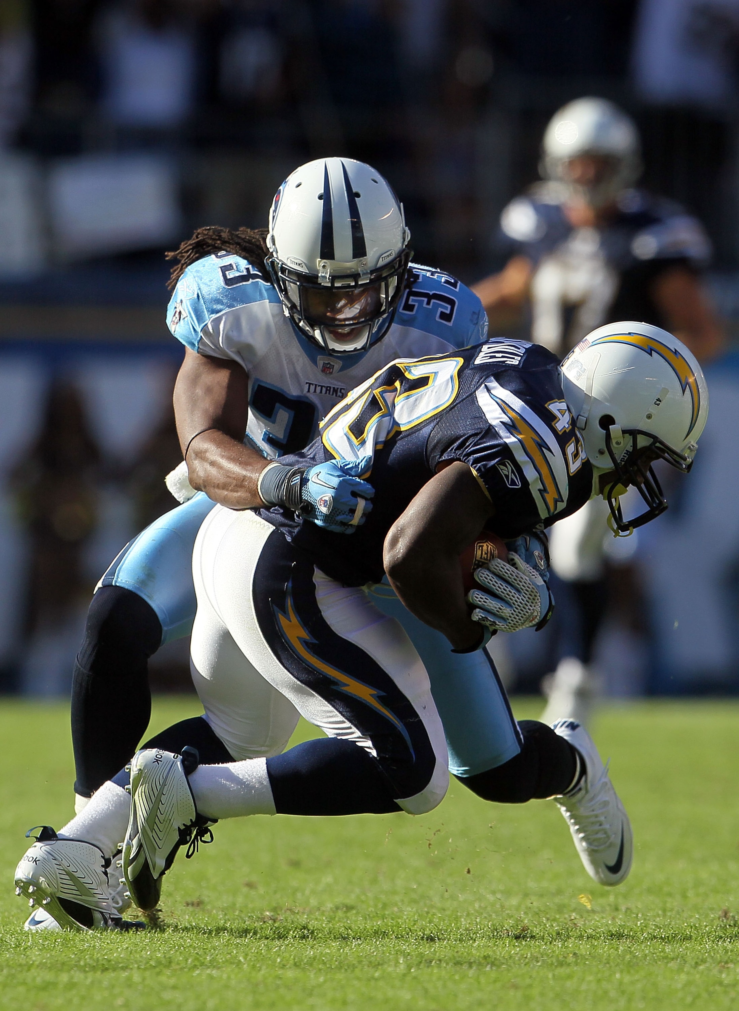 SAN DIEGO - OCTOBER 31:  Running back Darren Sproles #43 of the San Diego Chargers is pursued by Michael Griffin #33 of the Tennessee Titans in the game at Qualcomm Stadium on October 31, 2010 in San Diego, California. The Chargers defeated the Titans 33-