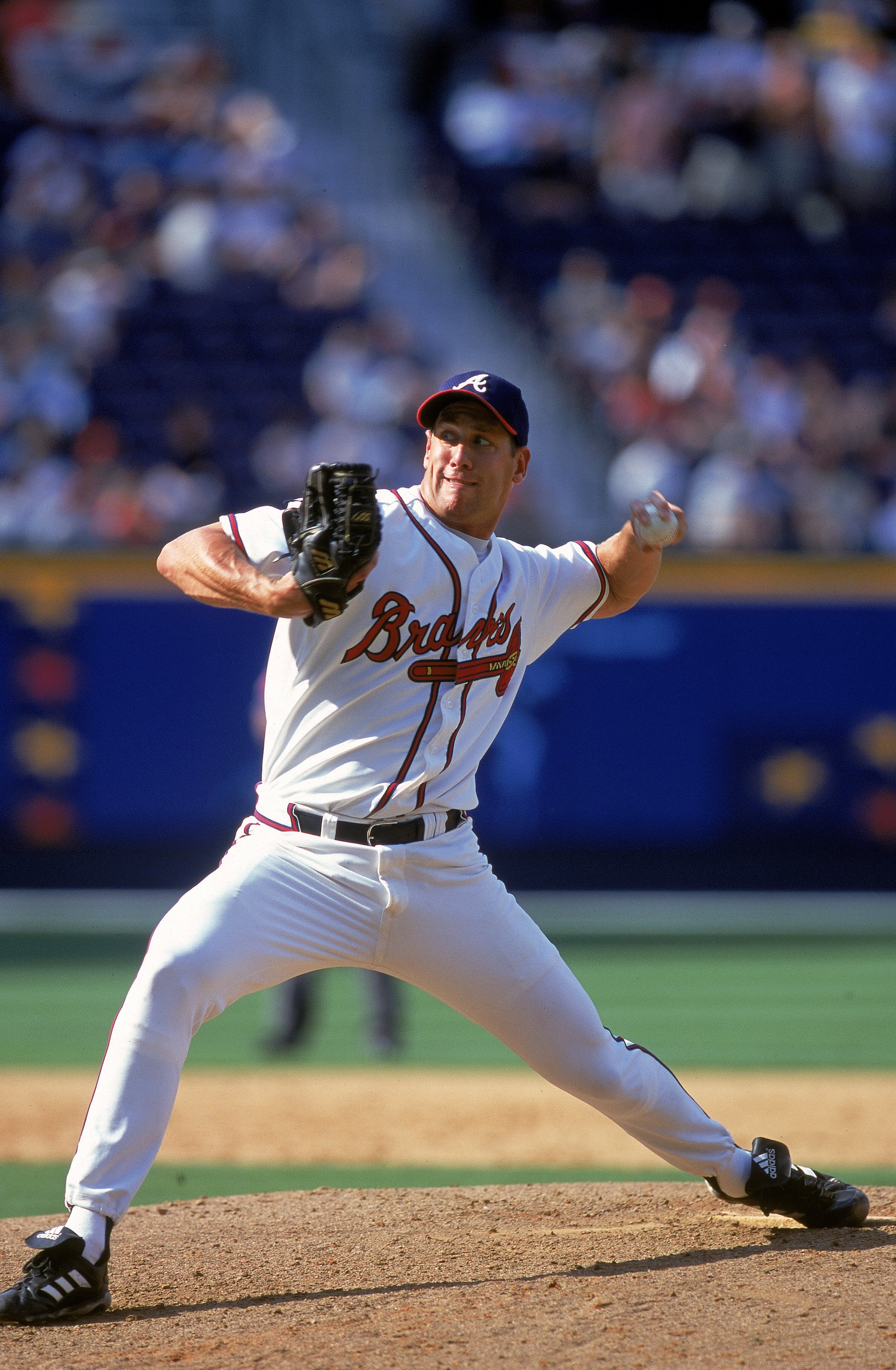 Pitcher John Rocker #49 of the Atlanta Braves winds up for the pitch during the game against the Cleveland Indians at Turner Field in Atlanta, Georgia.