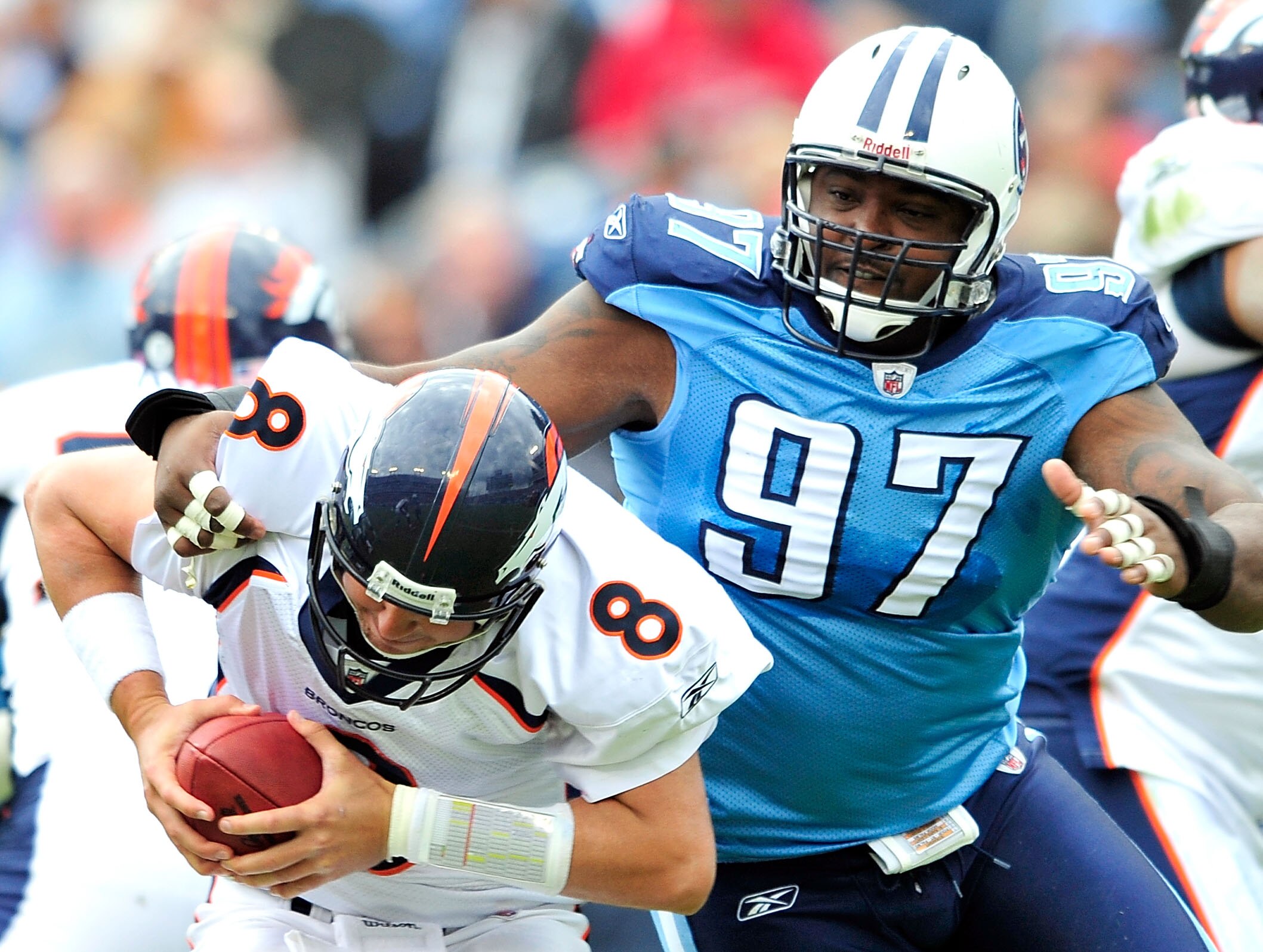 NASHVILLE, TN - OCTOBER 03:  Tony Brown #97 of the Tennessee Titans pressures quarterback Kyle Orton #8 of the Denver Broncos during the first half at LP Field on October 3, 2010 in Nashville, Tennessee.  (Photo by Grant Halverson/Getty Images)