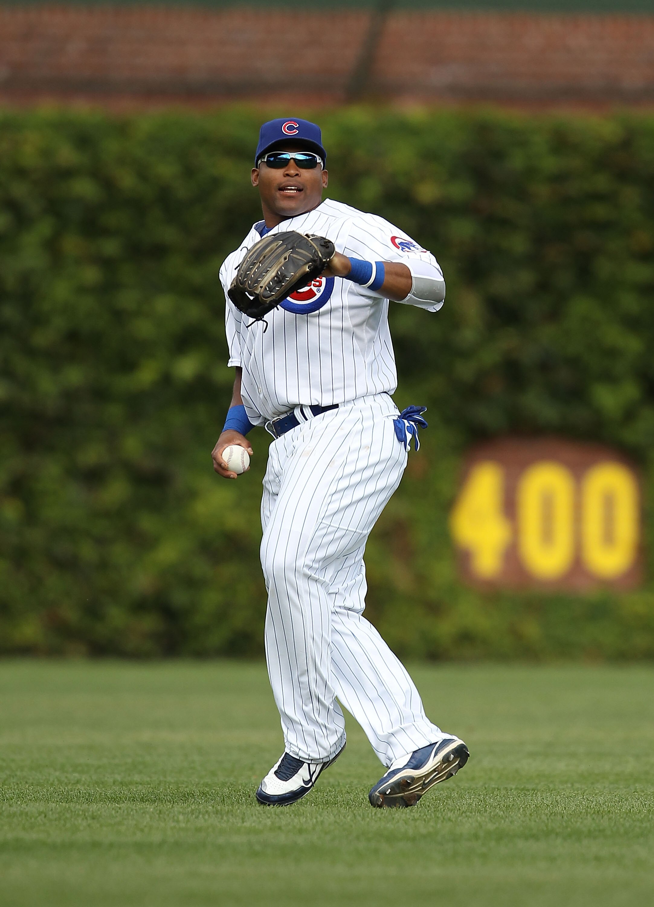 CHICAGO - SEPTEMBER 05: Marlon Byrd #24 of the Chicago Cubs prepares to throw the ball to the infield against the New York Mets at Wrigley Field on September 5, 2010 in Chicago, Illinois. The Mets defeated the Cubs 18-5. (Photo by Jonathan Daniel/Getty Im