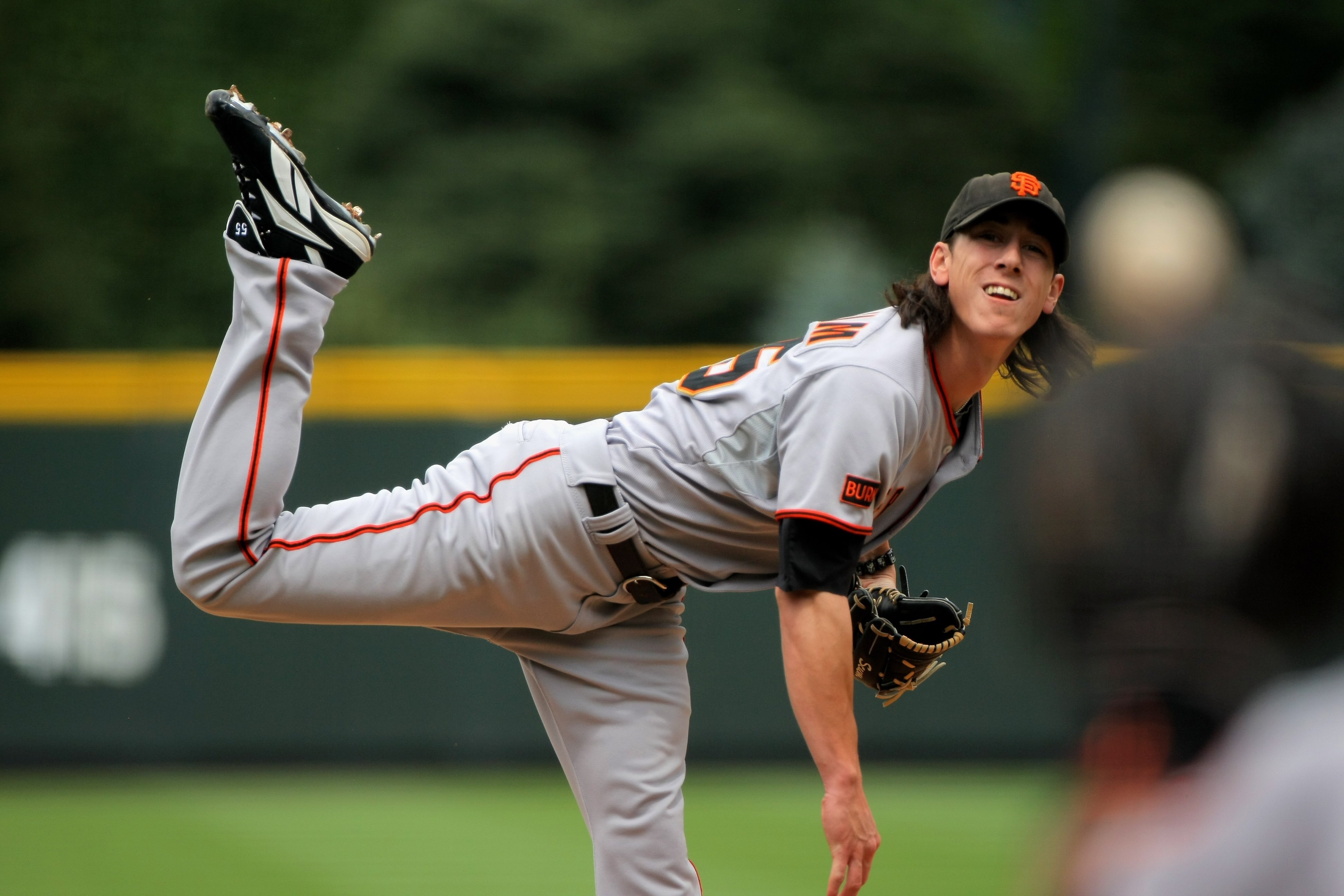 DENVER - AUGUST 23:  Starting pitcher Tim Lincecum #55 of the San Francisco Giants delivers against the Colorado Rockies at Coors Field on August 23, 2009 in Denver, Colorado. Lincecum collected the loss as the Rockies defeated the Giants 4-2.  (Photo by