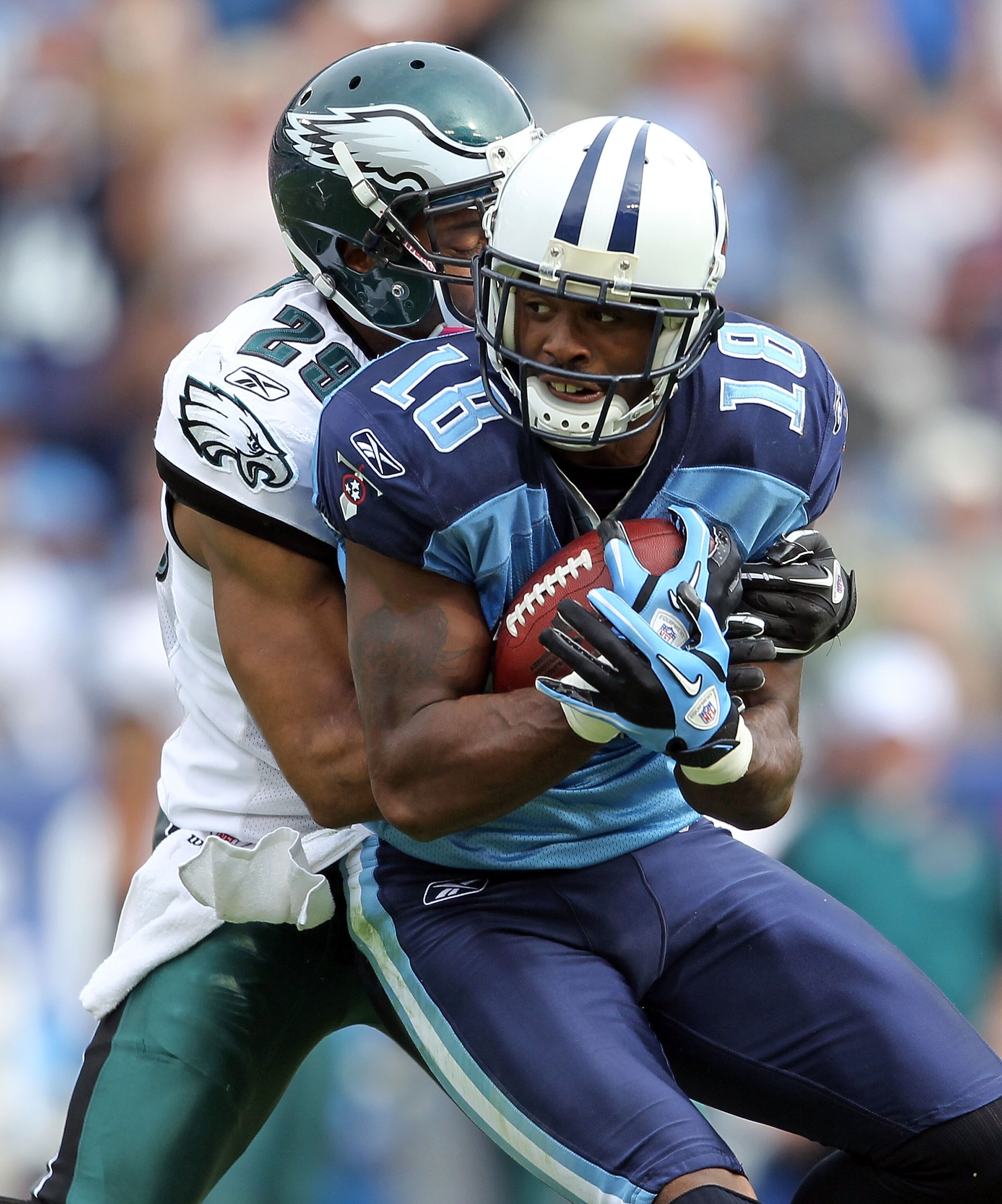 NASHVILLE, TN - OCTOBER 24:  Kenny Britt #18 of the Tennessee Titans catches a pass while defended by Nate Allen #29 of the Philadelphia Eagles during the NFL game at LP Field on October 24, 2010 in Nashville, Tennessee. The Titans won 37-19.  (Photo by A