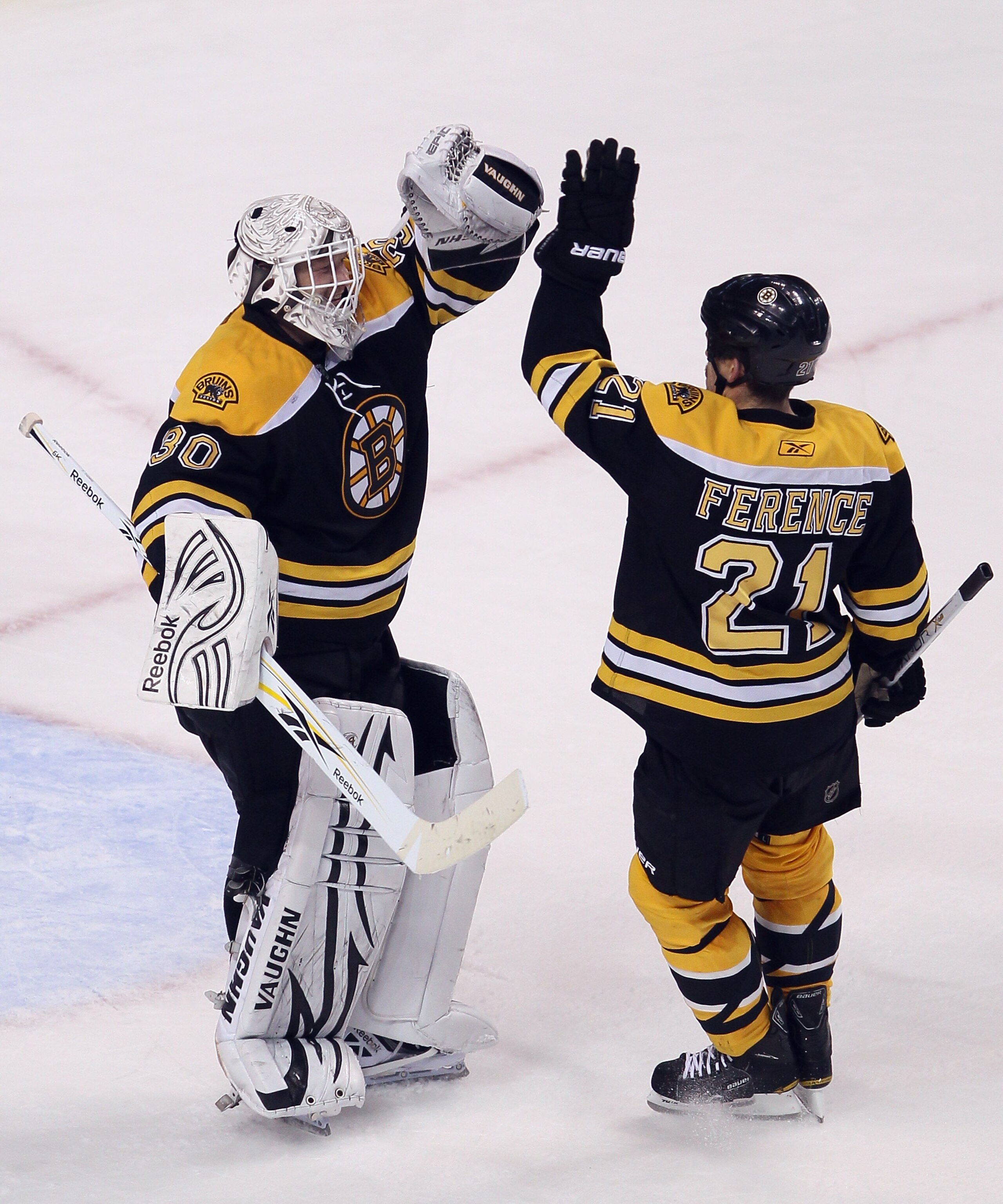 BOSTON - NOVEMBER 15:  Tim Thomas #30 of the Boston Bruins is congratulated by teammate Andrew Ference #21 after the win over the New Jersey Devils on November 15, 2010 at the TD Garden in Boston, Massachusetts. The Bruins shut out the Devils 3-0. (Photo 