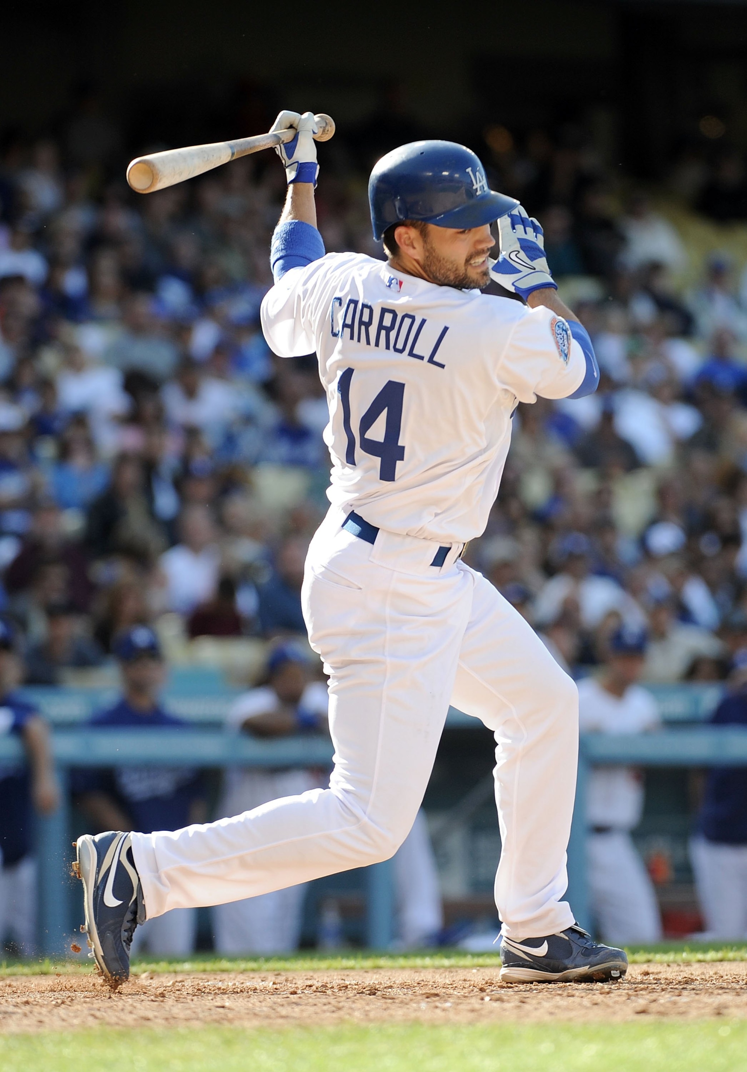 LOS ANGELES, CA - MAY 22:  Jamey Carroll #14 of the Los Angeles Dodgers takes a swing during his at bat against the Detroit Tigers at Dodger Stadium on May 22, 2010 in Los Angeles, California.  (Photo by Harry How/Getty Images)