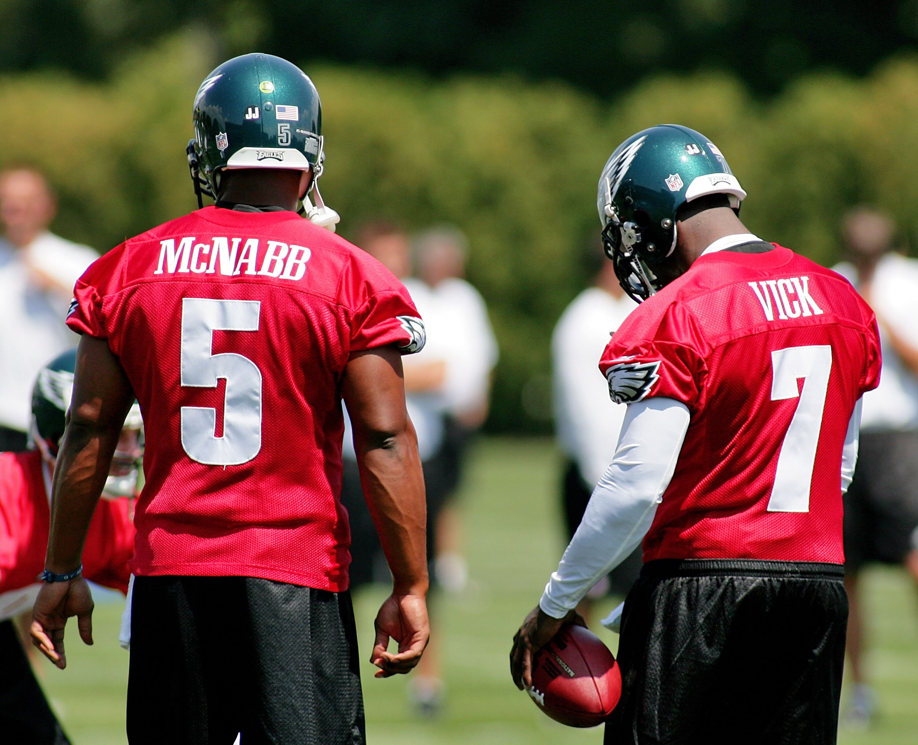 PHILADELPHIA - AUGUST 15:  Donovan McNabb #5 and Michael Vick #7 look on during a workout at the NovaCare Complex on August 15, 2009 in Philadelphia, Pennsylvania.  (Photo by Len Redkoles/Getty Images)