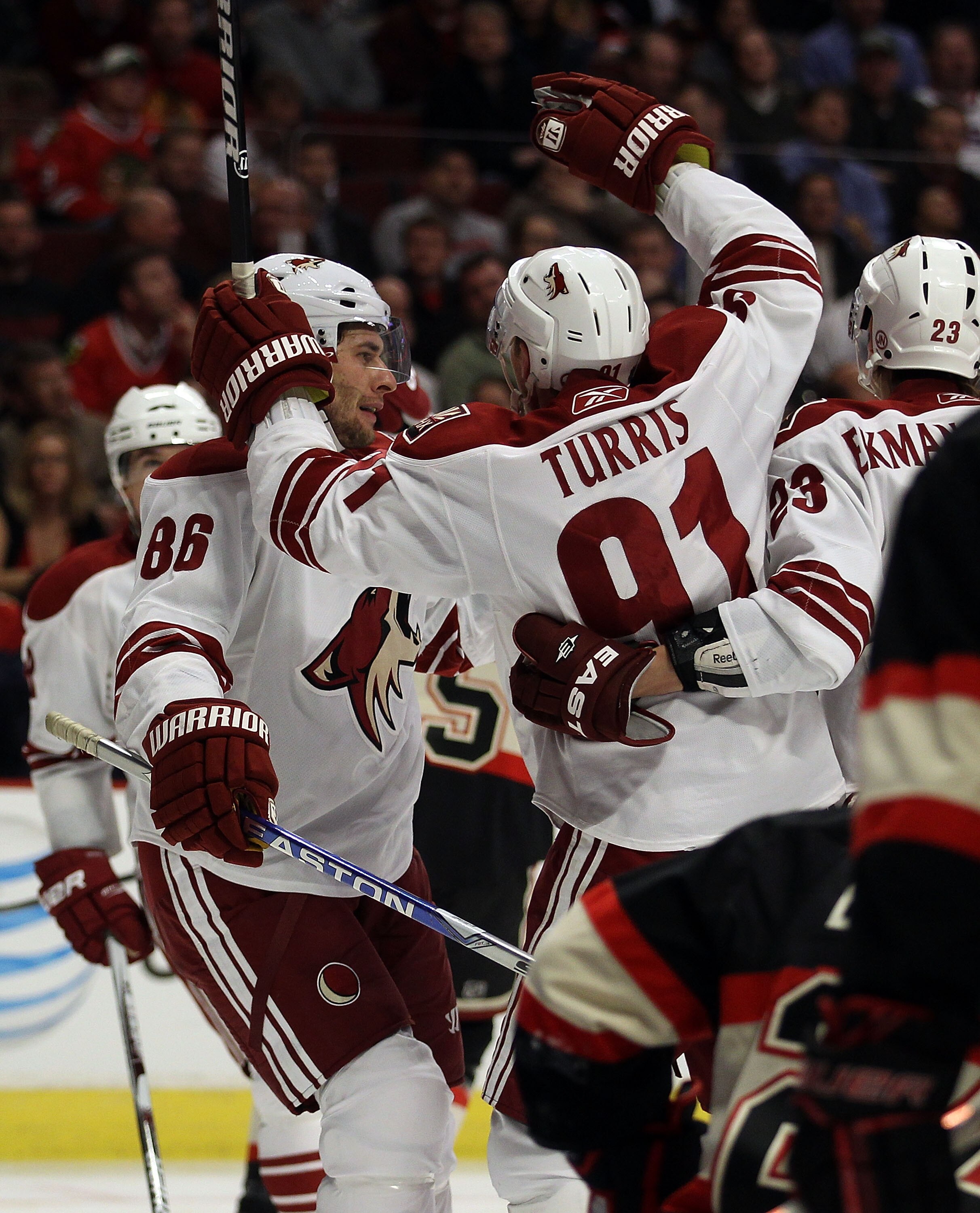 CHICAGO - NOVEMBER 10: Members of the Phoenix Coyotes including Wojtek Wolski #86, Kyle Turris #91 and Oliver Ekman-Larsson #23 celebrate a 2nd period goal against the Chicago Blackhawks at the United Center on November 10, 2010 in Chicago, Illinois. (Pho