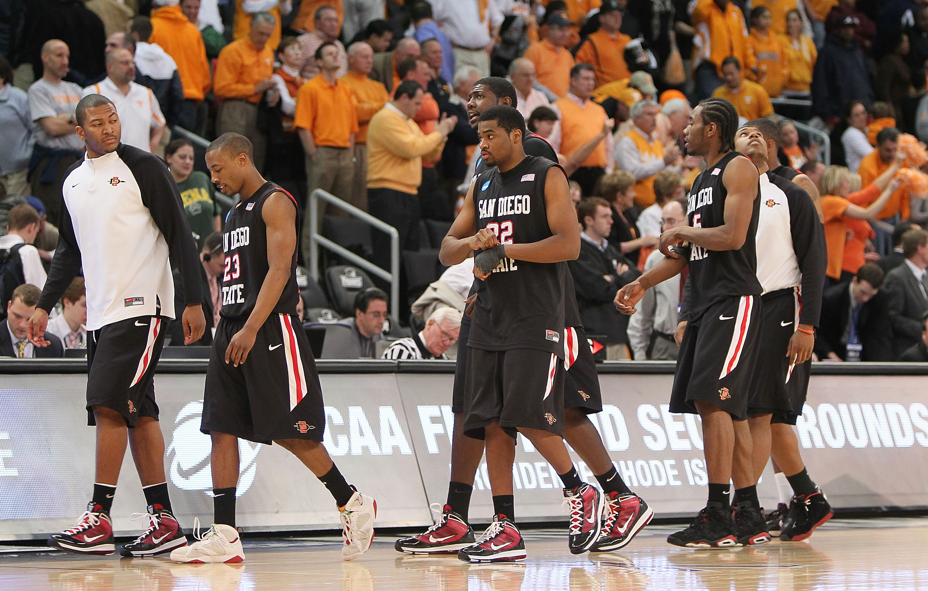 PROVIDENCE, RI - MARCH 19: Members of the San Diego State Aztecs leave the court after a 62-59 loss to the Tennessee Volunteers during the first round of the 2010 NCAA men's basketball tournament at Dunkin' Donuts Center on March 19, 2010 in Providence, PROVIDENCE, RI - MARCH 19: Members of the San Diego State Aztecs leave the court after a 62-59 loss to the Tennessee Volunteers during the first round of the 2010 NCAA men's basketball tournament at Dunkin' Donuts Center on March 19, 2010 in Providence,