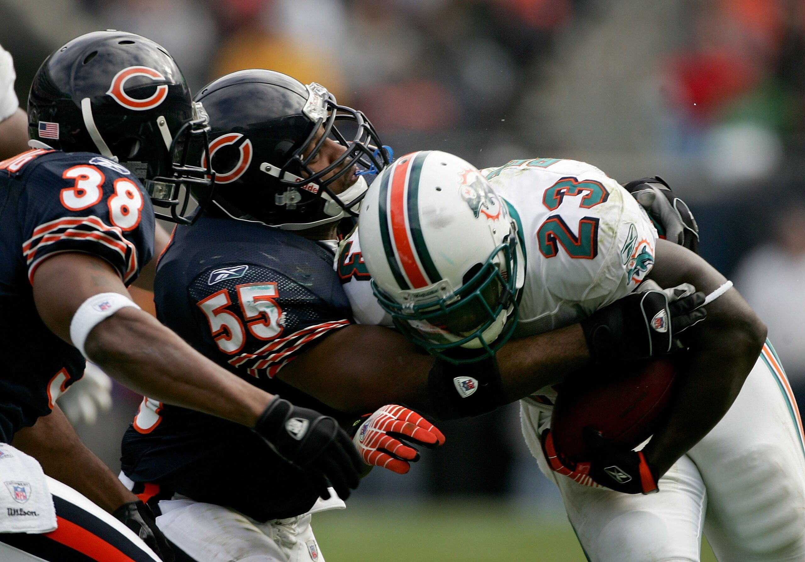 CHICAGO - NOVEMBER 05: Lance Briggs #55 of the Chicago Bears stops Ronnie Brown #23 of the Miami Dolphins during game action on November 5, 2006 at Soldier Field in Chicago, Illinois. (Photo by Jonathan Daniel/Getty Images)