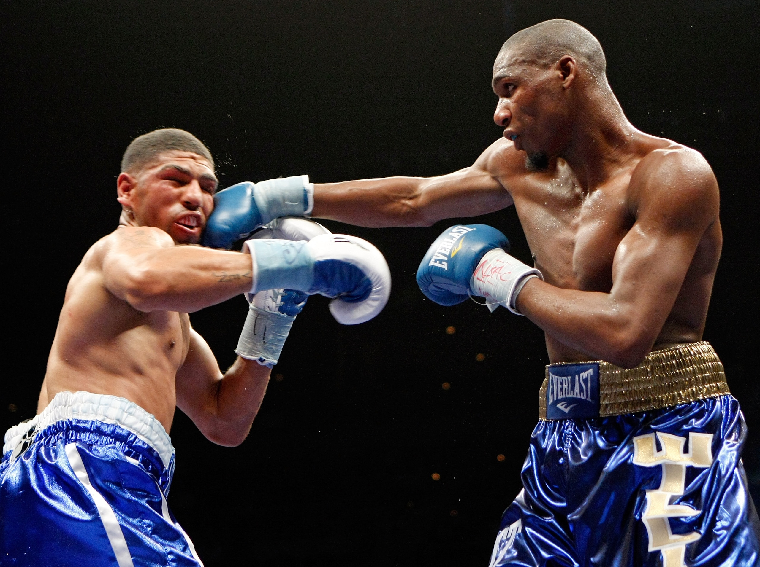 LAS VEGAS - APRIL 11:  Paul Williams (R) hits Winky Wright in the eighth round of their middleweight bout at the Mandalay Bay Events Center April 11, 2009 in Las Vegas, Nevada. Williams won by unanimous decision.  (Photo by Ethan Miller/Getty Images)