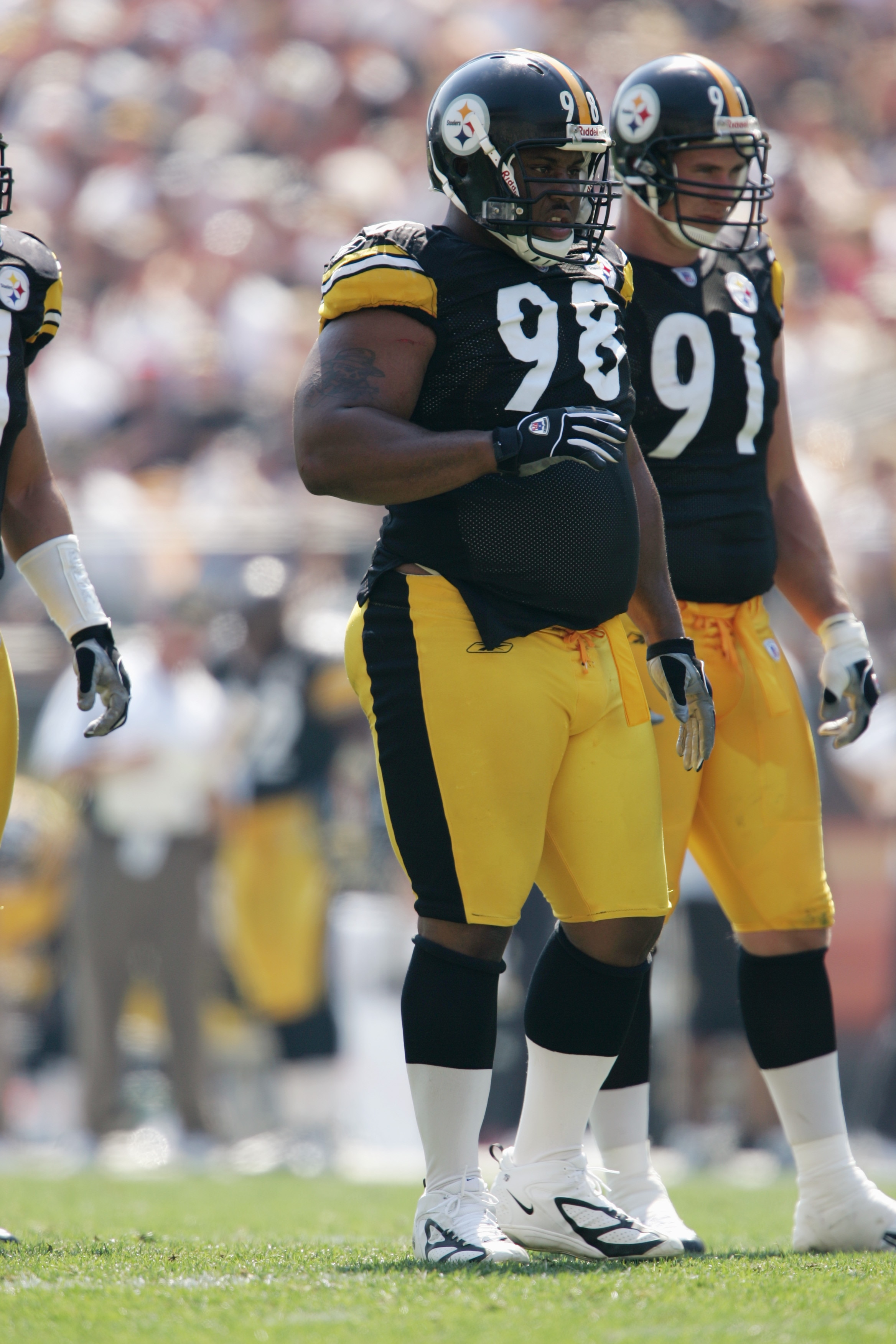 PITTSBURGH - SEPTEMBER 12:  Nose tackle Casey Hampton #98 of the Pittsburgh Steelers stands next to his teammate defensive end Aaron Smith #91 during the game against the Oakland Raiders at Heinz Field on September 12, 2004 in Pittsburgh, Pennsylvania. Th