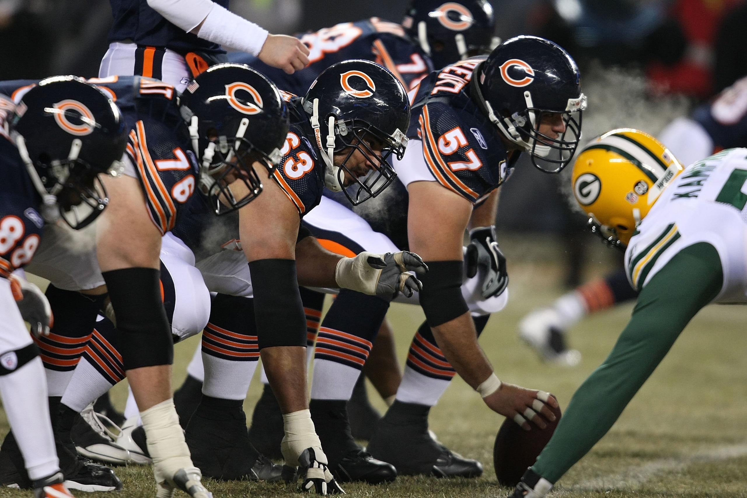 CHICAGO - DECEMBER 22: Members of the Chicago Bear offensive line including Olin Kreutz #57, Roberto Garza #63 and John Tait #76 line-up in front of the Green Bay Packer defense on December 22, 2008 at Soldier Field in Chicago, Illinois. The Bears defeate