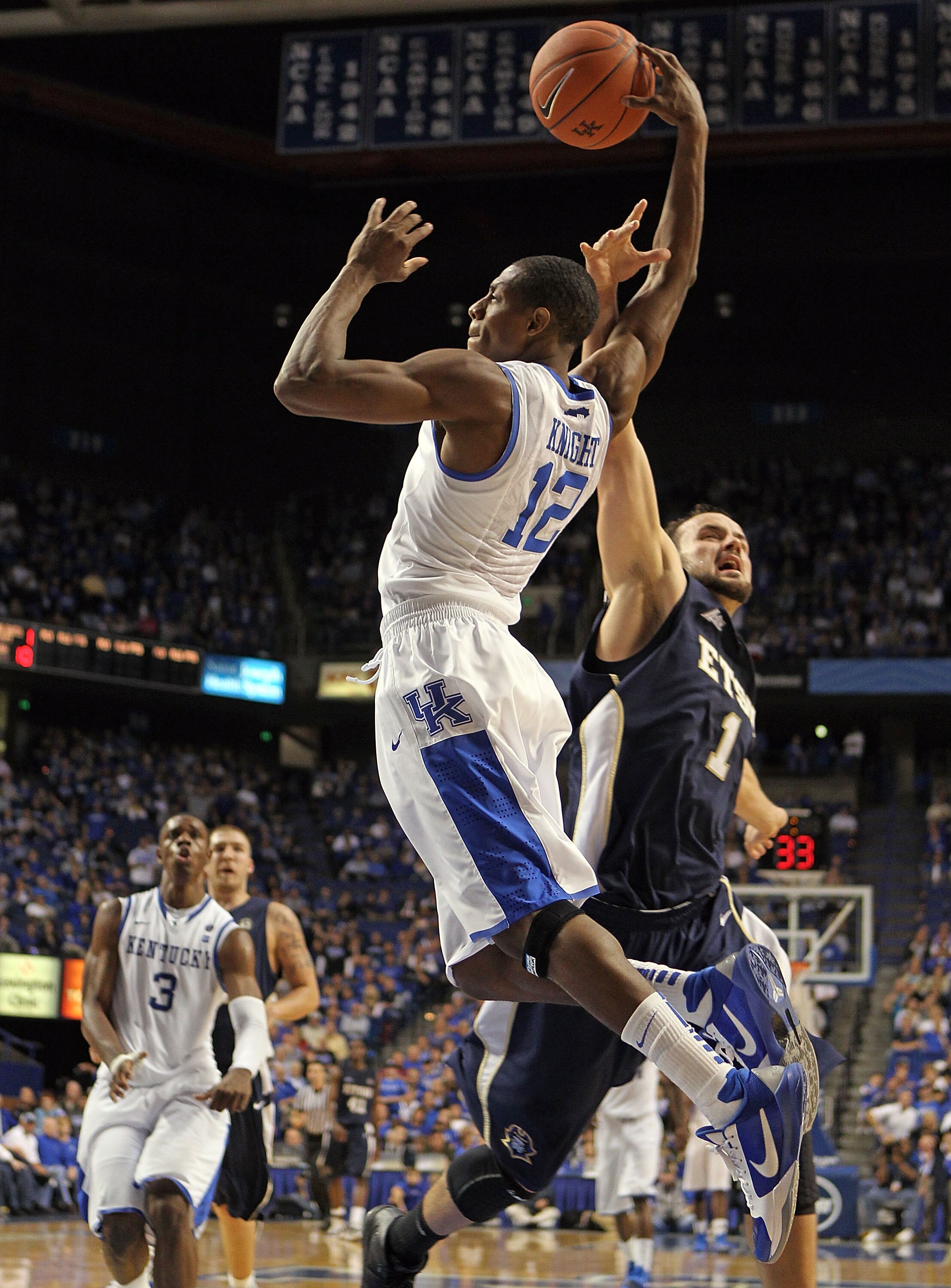 LEXINGTON, KY - NOVEMBER 12: Brandon Knight #12 of the Kentucky Wildcats shoots the ball while defended by Mike Smith #1 of the East Tennessee State Buccaneers during the game at Rupp Arena on November 12, 2010 in Lexington, Kentucky. Kentucky won 88-65. LEXINGTON, KY - NOVEMBER 12: Brandon Knight #12 of the Kentucky Wildcats shoots the ball while defended by Mike Smith #1 of the East Tennessee State Buccaneers during the game at Rupp Arena on November 12, 2010 in Lexington, Kentucky. Kentucky won 88-65.