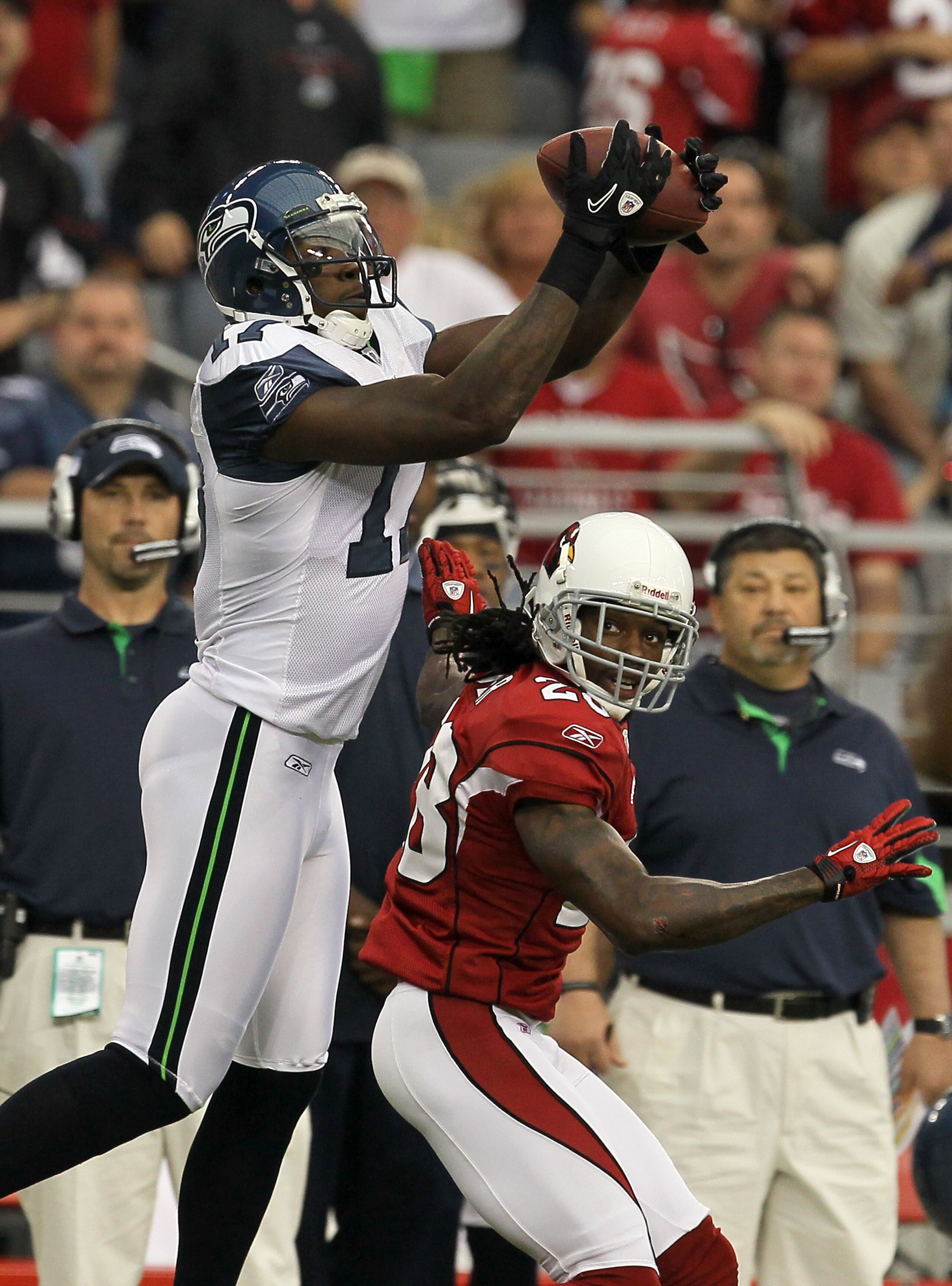 GLENDALE, AZ - NOVEMBER 14:  Wide receiver Mike Williams #17 of the Seattle Seahawks makes a catch over cornerback Greg Toler #28 of the Arizona Cardinals at University of Phoenix Stadium on November 14, 2010 in Glendale, Arizona. Seattle won 36-18.  (Pho
