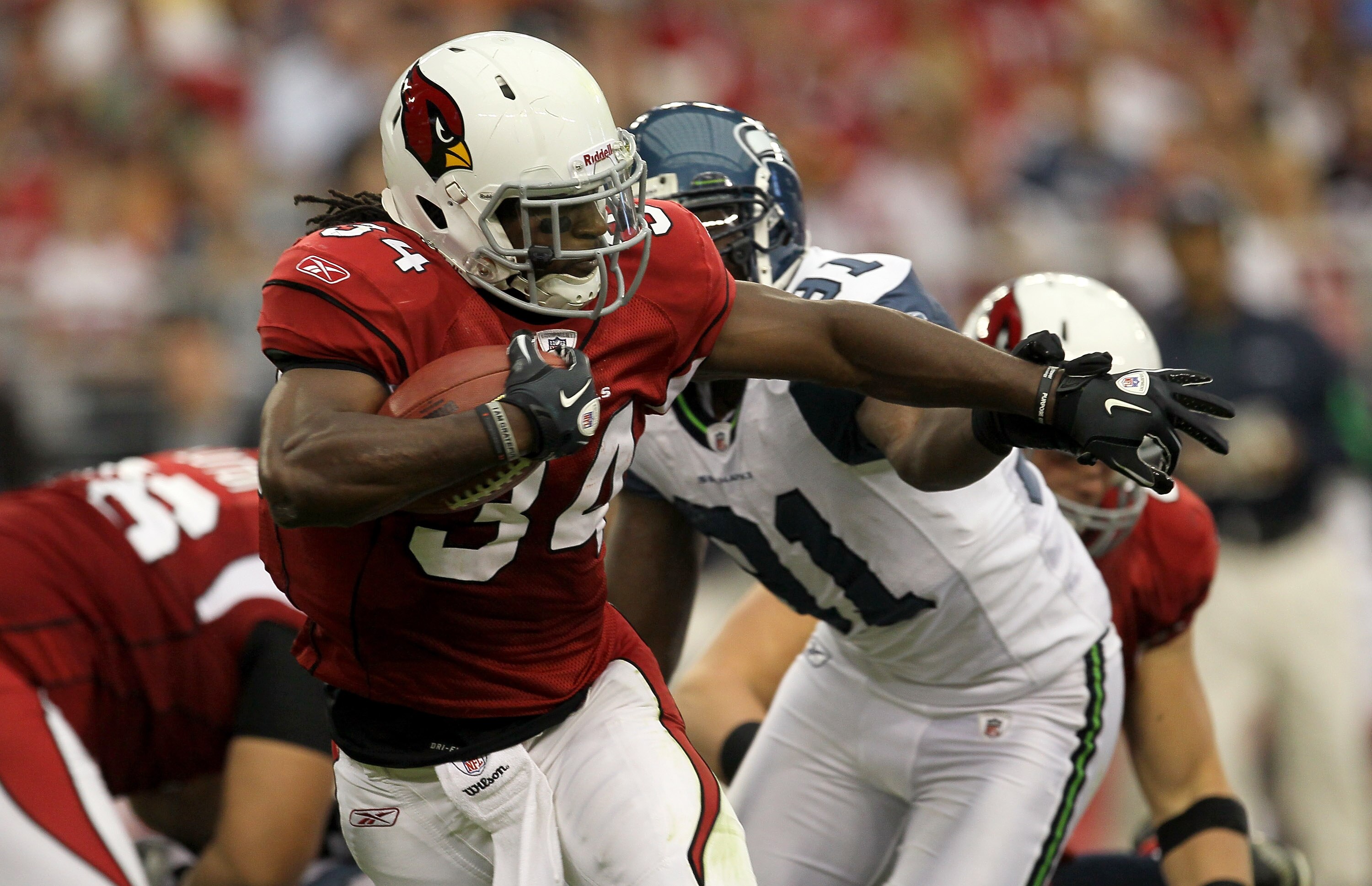 GLENDALE, AZ - NOVEMBER 14:  Running back Tim Hightower #34 of the Arizona Cardinals carries the ball against the Seattle Seahawks at University of Phoenix Stadium on November 14, 2010 in Glendale, Arizona. (Photo by Stephen Dunn/Getty Images)
