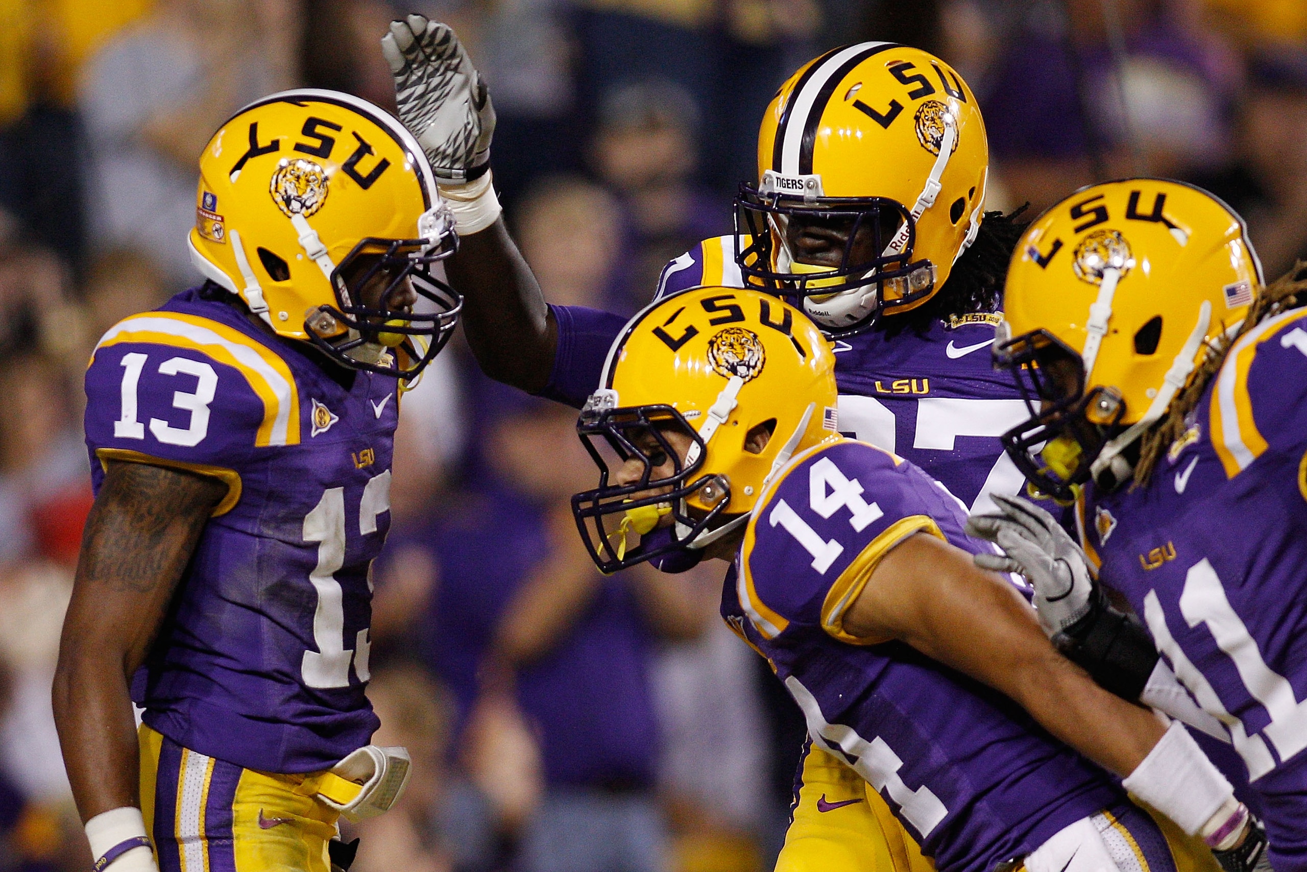 BATON ROUGE, LA - NOVEMBER 13:  Ron Brooks #13 of the Louisiana State University Tigers celebrates after scoring a touchdown on an interception during the game against the University of Louisiana-Monroe Warhawks at Tiger Stadium on November 13, 2010 in Ba