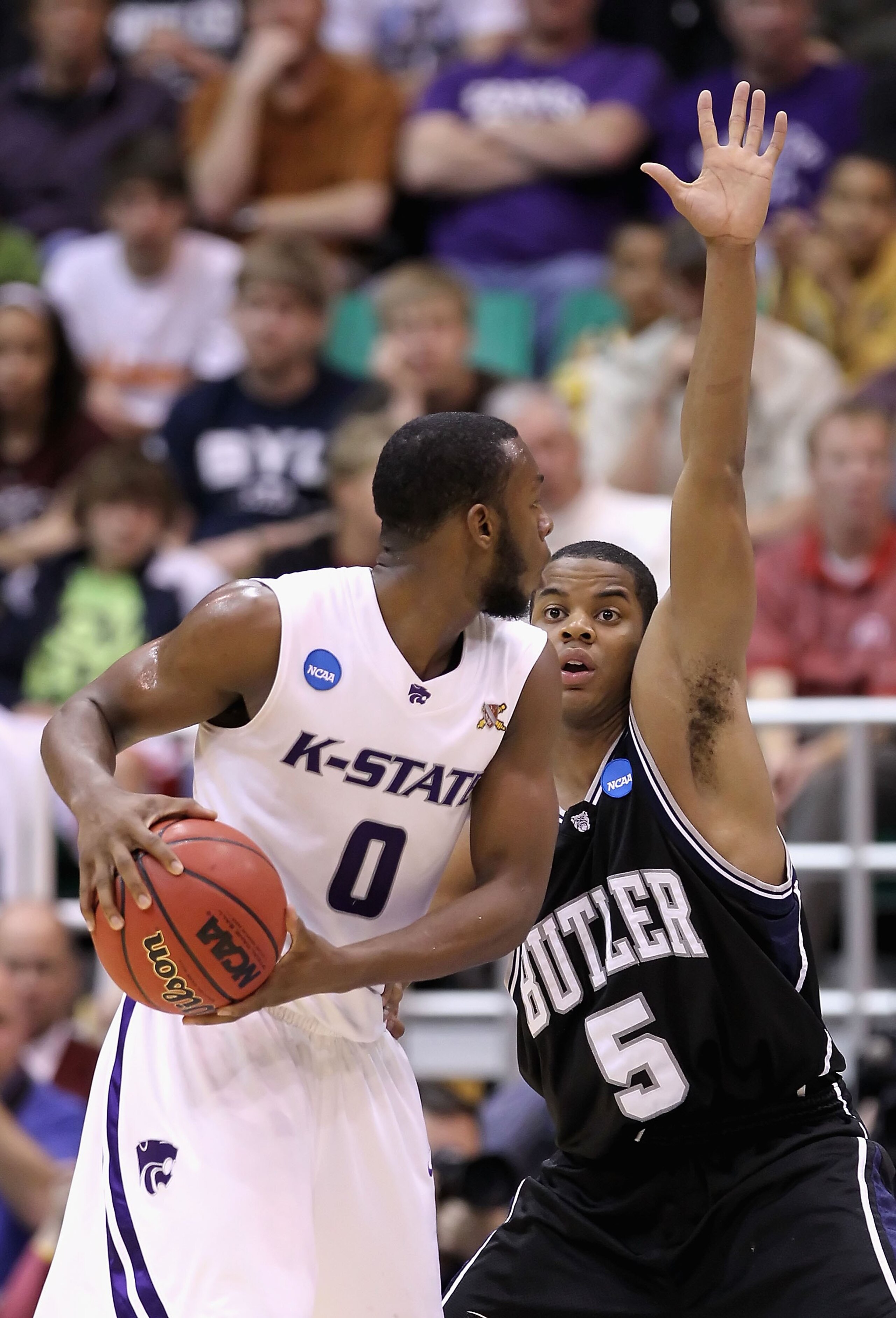SALT LAKE CITY - MARCH 27:  Ronald Nored #5 of the Butler Bulldogs defends against Jacob Pullen #0 of the Kansas State Wildcats during the west regional final of the 2010 NCAA men's basketball tournament at the Energy Solutions Arena on March 27, 2010 in