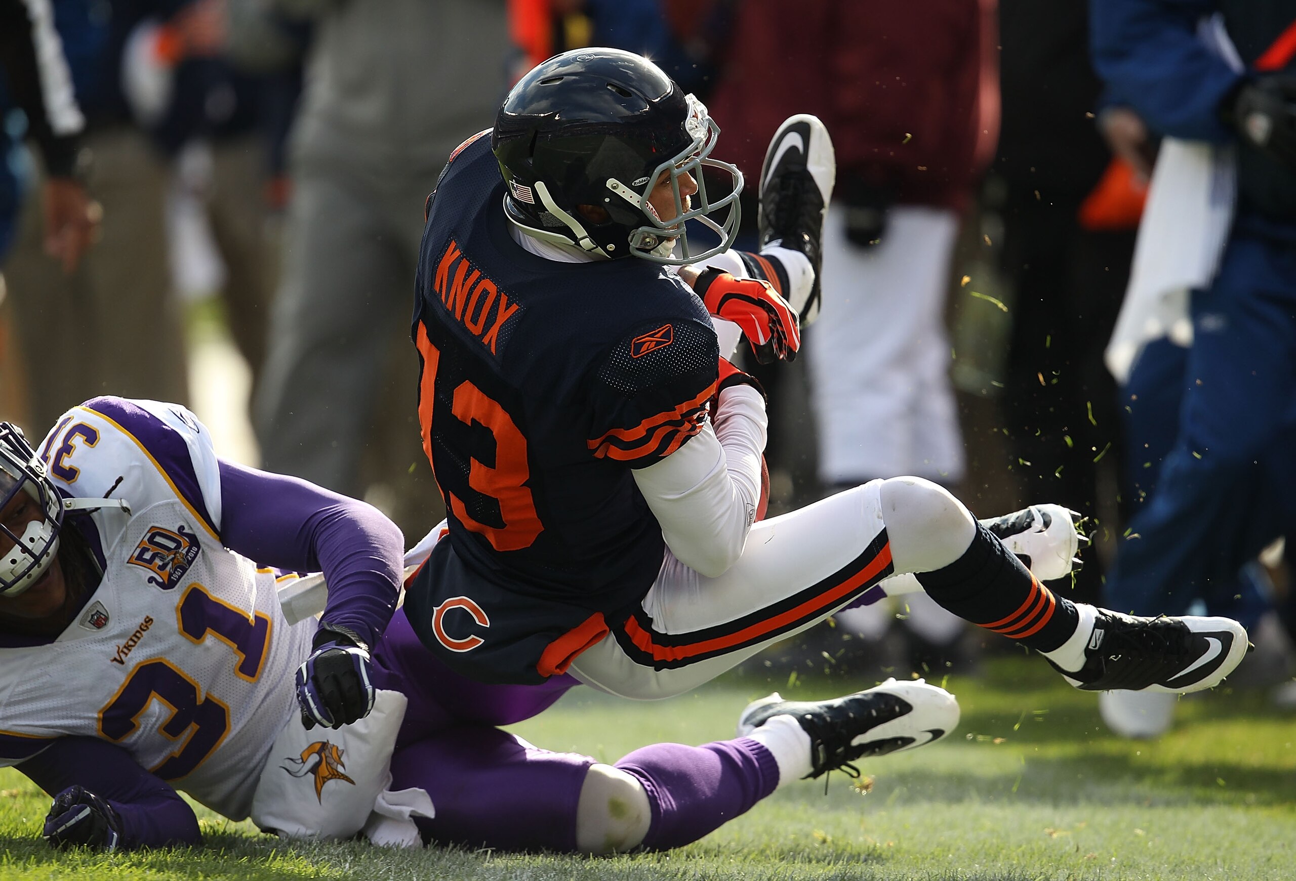 CHICAGO - NOVEMBER 14: Johnny Knox #13 of the Chicago Bears is tackled by Chris Cook #31 of the Minnesota Vikings at Soldier Field on November 14, 2010 in Chicago, Illinois. The Bears defeated the Vikings 27-13. (Photo by Jonathan Daniel/Getty Images)