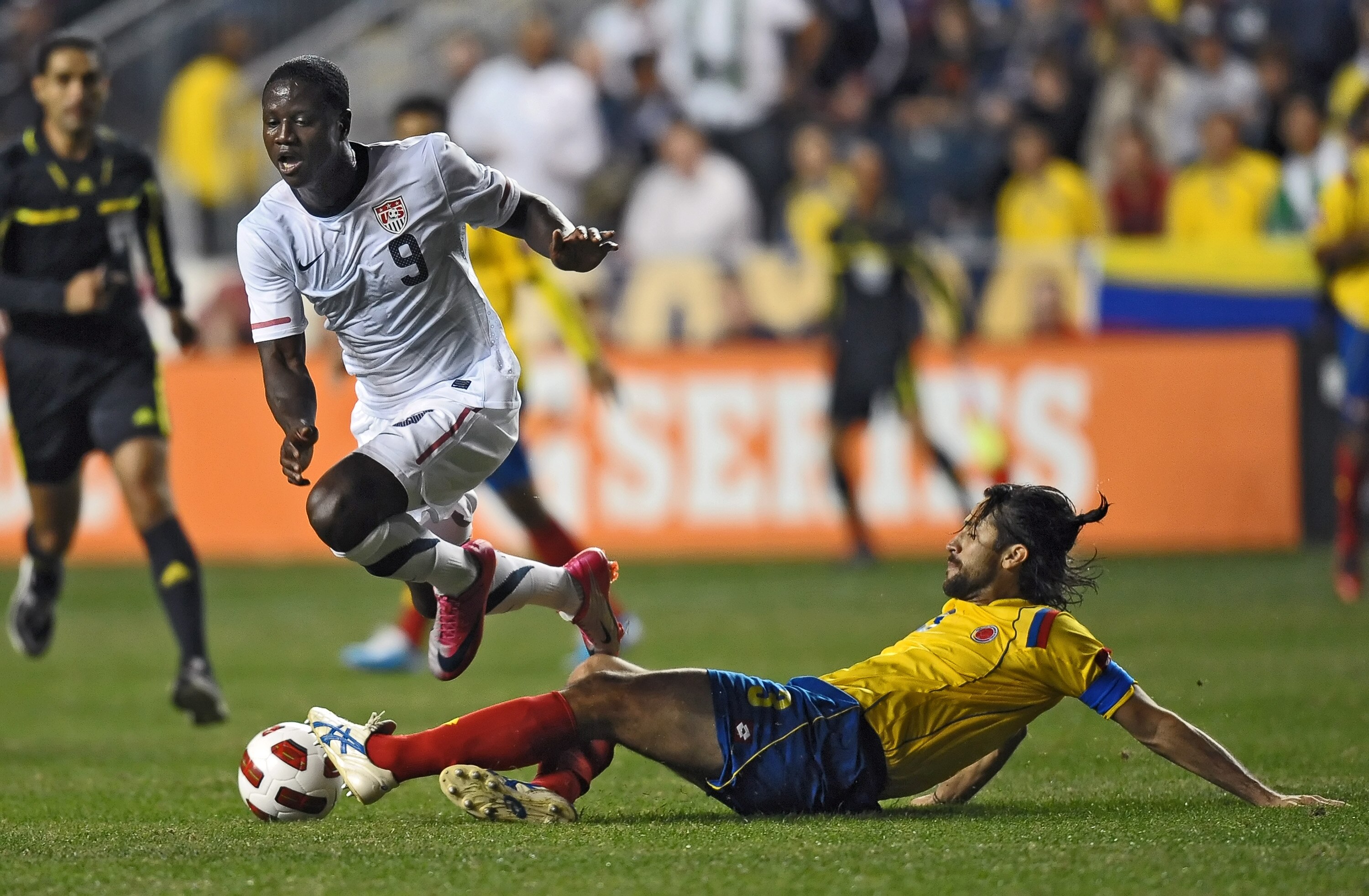 CHESTER, PA - OCTOBER 12: Eddie Johnson #9 of the United States gets tripped up by a sliding Mario Yepes #3 of Colombia at PPL Park on October 12, 2010 in Chester, Pennsylvania. The game ended in a 0-0 tie. (Photo by Drew Hallowell/Getty Images)