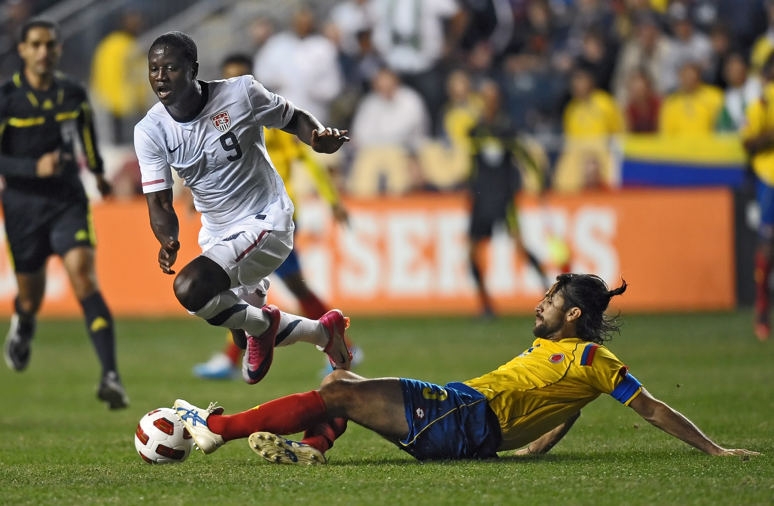 CHESTER, PA - OCTOBER 12: Eddie Johnson #9 of the United States gets tripped up by a sliding Mario Yepes #3 of Colombia at PPL Park on October 12, 2010 in Chester, Pennsylvania. The game ended in a 0-0 tie. (Photo by Drew Hallowell/Getty Images)