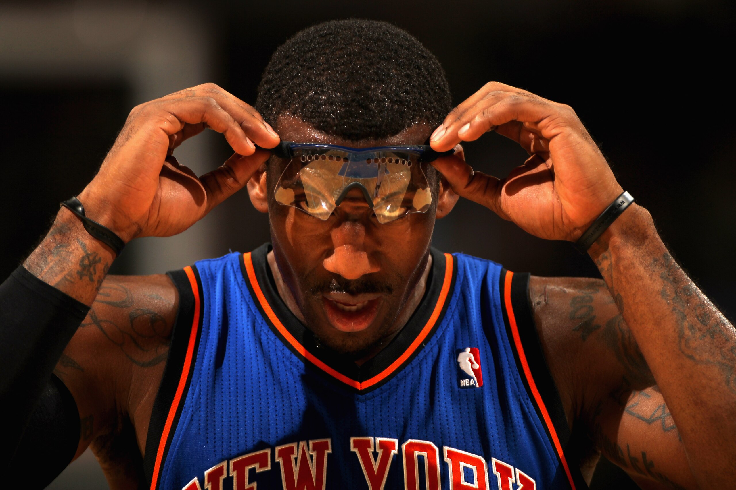 DENVER - NOVEMBER 16:  Amar'e Stoudemire #1 of the New York Knicks adjusts his glasses as he faces the Denver Nuggets at the Pepsi Center on November 16, 2010 in Denver, Colorado. NOTE TO USER: User expressly acknowledges and agrees that, by downloading a