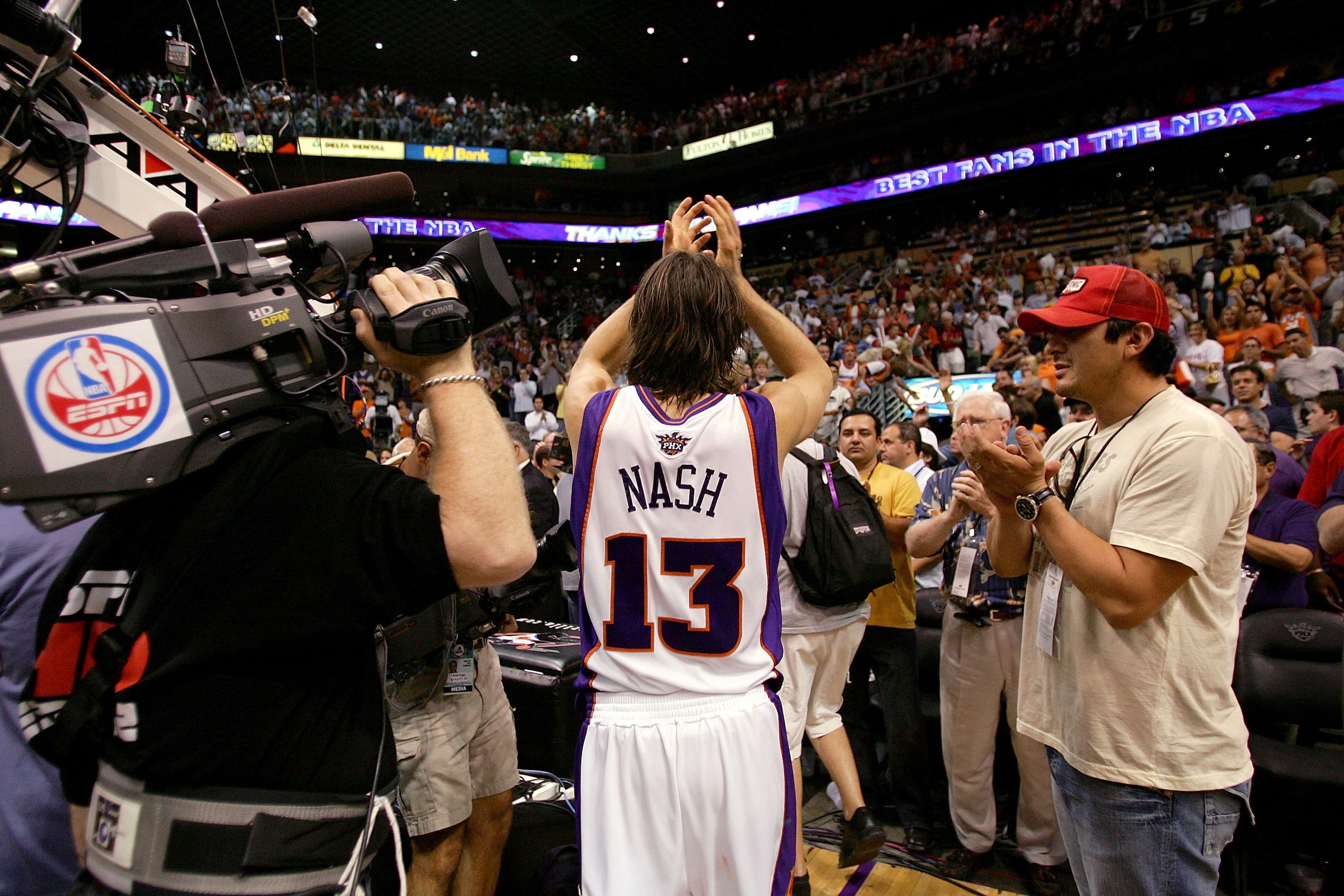 PHOENIX - JUNE 1:  Steve Nash #13 of the Phoenix Suns applaudes the fans after losing to the San Antonio Spurs in Game five of the Western Conference Finals during the 2005 NBA Playoffs at America West Arena on June 1, 2005 in Phoenix, Arizona. The Spurs